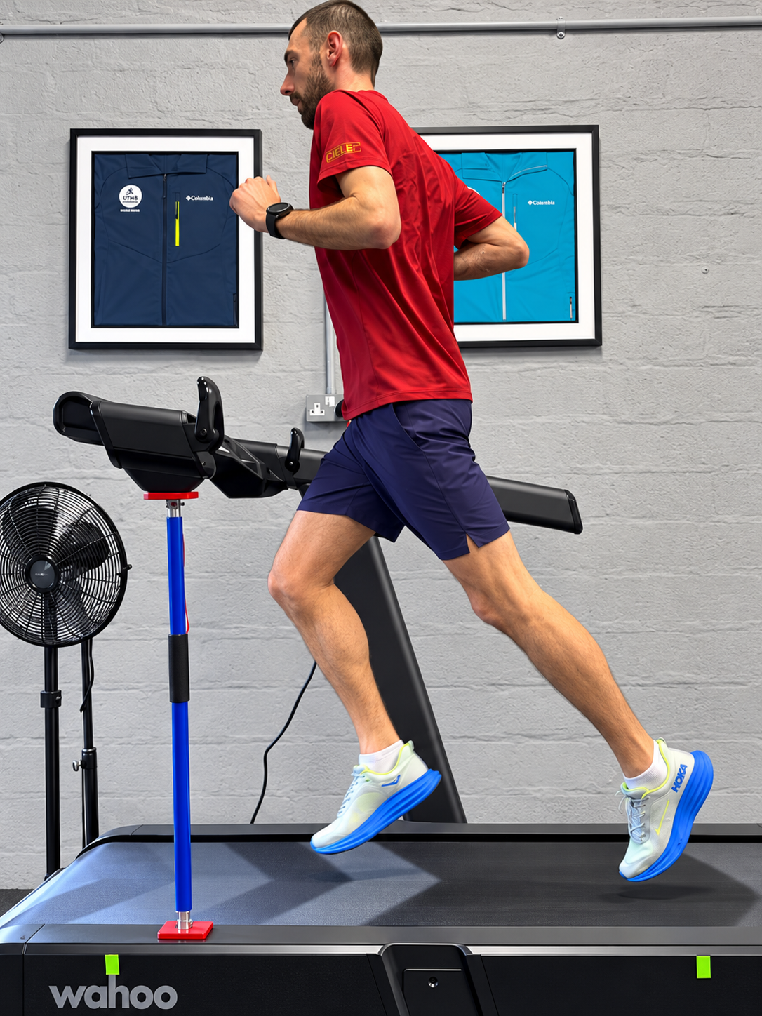 Man running on a Wahoo treadmill during an indoor workout