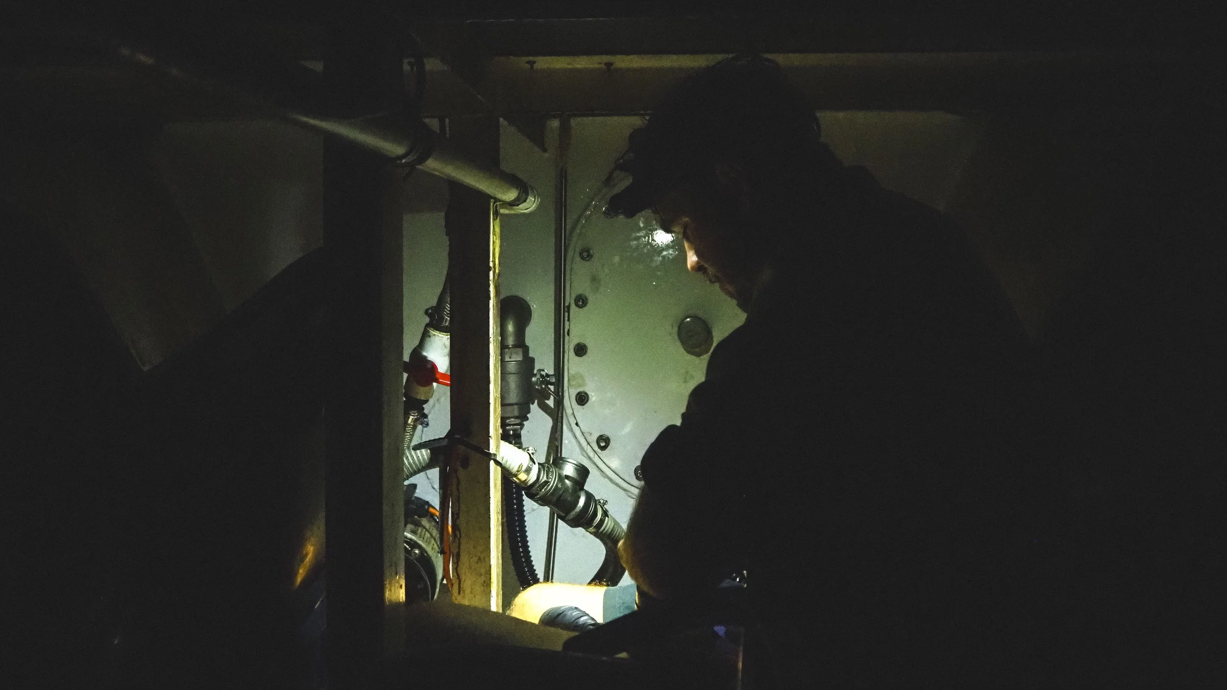  Skipper &amp; Engineer maintaining the forward bilge pump. 