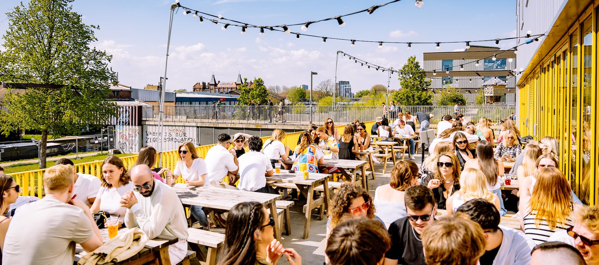 A photo showing a rooftop bar at Hackney Bridge