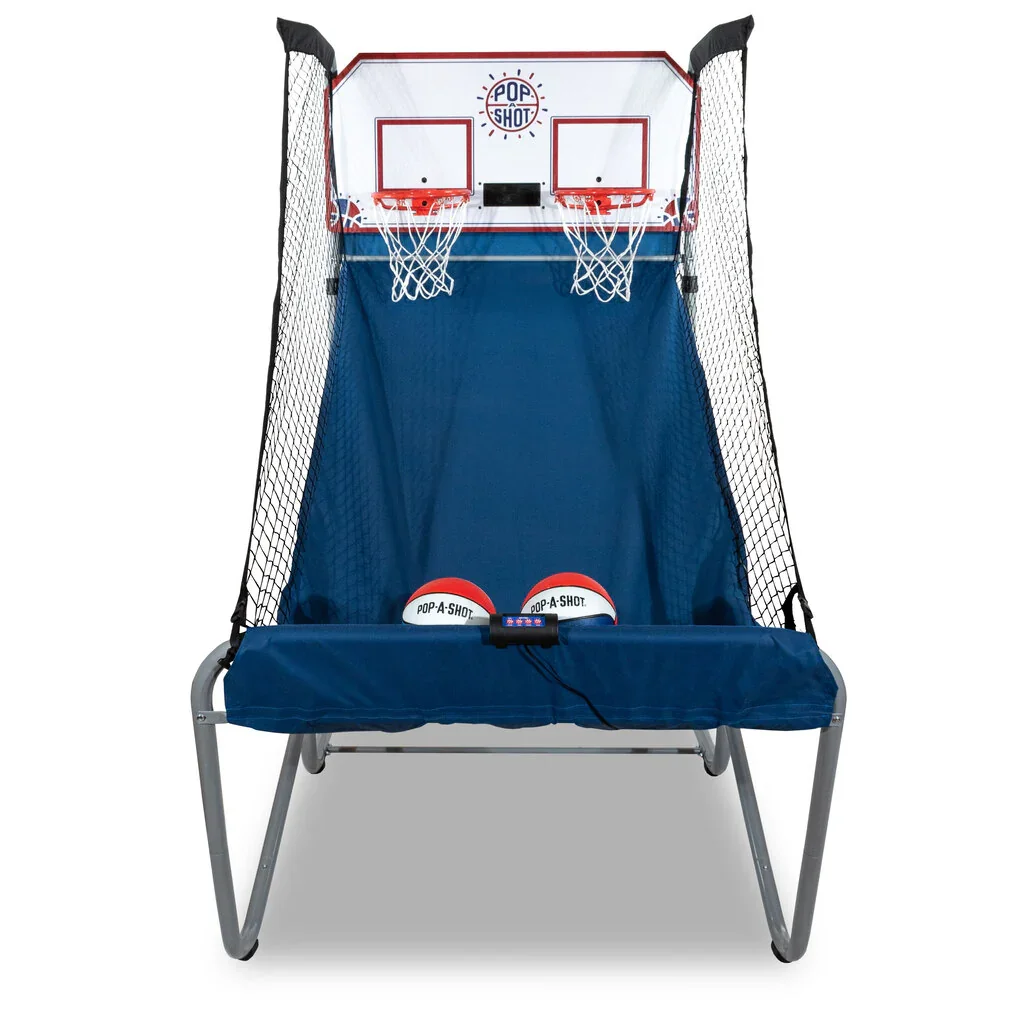 A tabletop basketball game with two small basketball hoops, two basketballs labeled "POP-A-SHOT," and a control button in the middle.