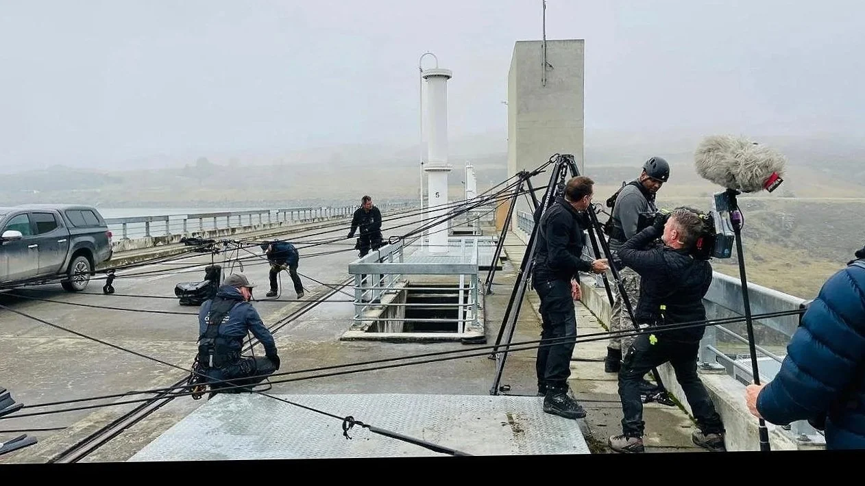 Rope rigging team supporting a film crew on a rooftop