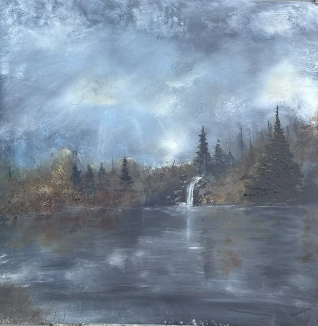 Silent Cascades invites the viewer into a place where rushing water is softened by distance, and the quiet beauty of the landscape takes center stage. Sunlight breaks gently through the clouds, illuminating the falls and reflecting across the still w