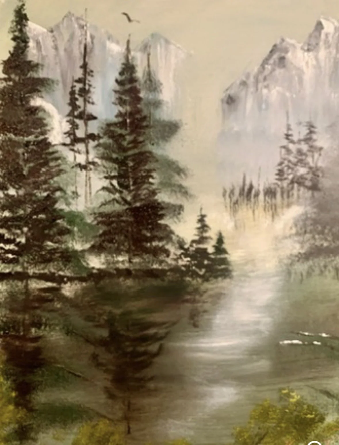 Title:
Mountain Serenity

Description:
Mountain Serenity invites the viewer into a quiet alpine valley where mist rises gently from still waters beneath towering snow-capped peaks. Evergreen forests frame the landscape while soft morning light fills 