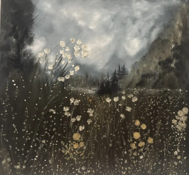 A peaceful meadow is filled with delicate flowers swaying gently. The backdrop includes towering pine trees with a cloudy sky above.