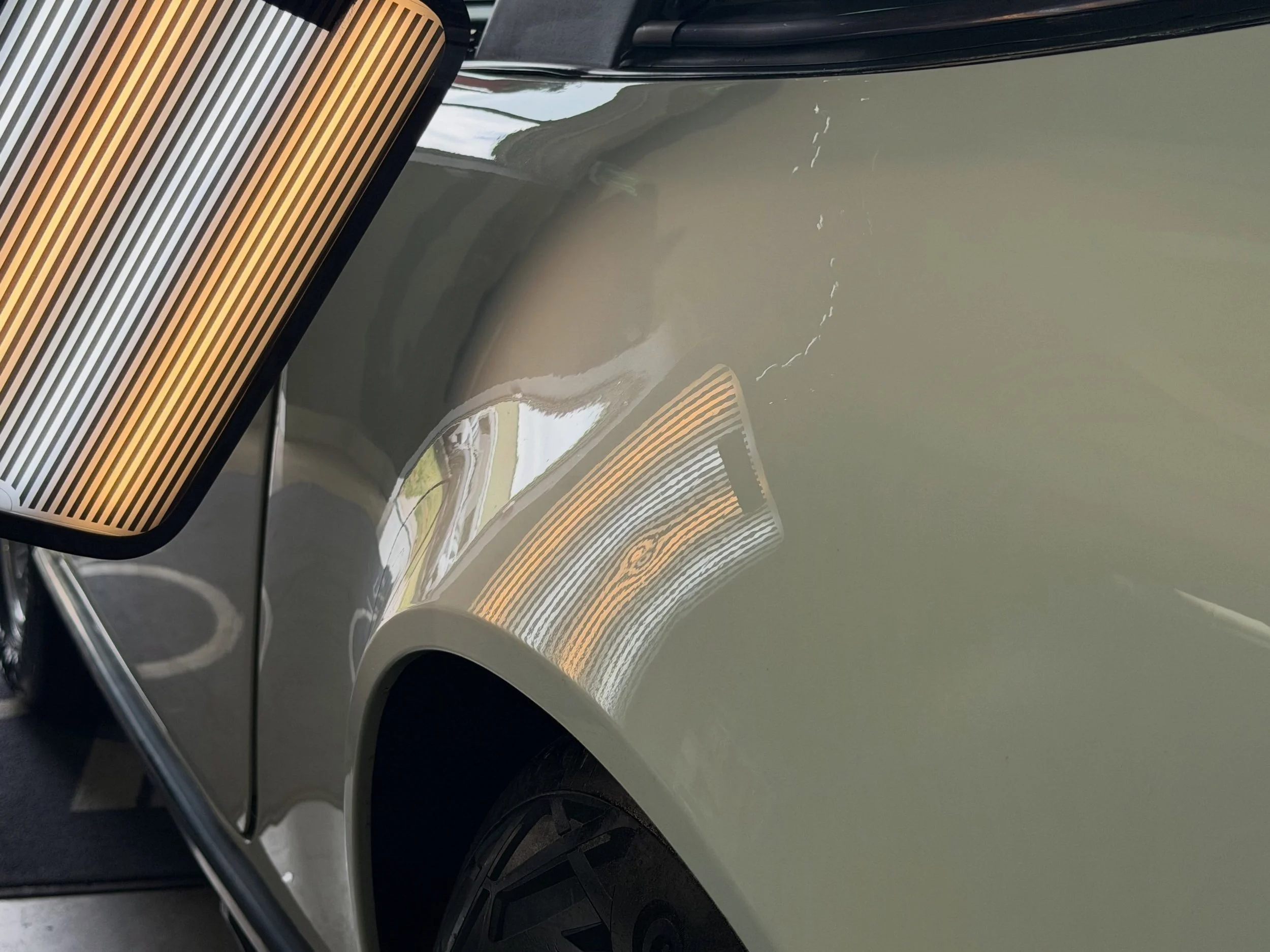 Before: Classic 911 Super Carrera passengers side rear quarter with a small dent