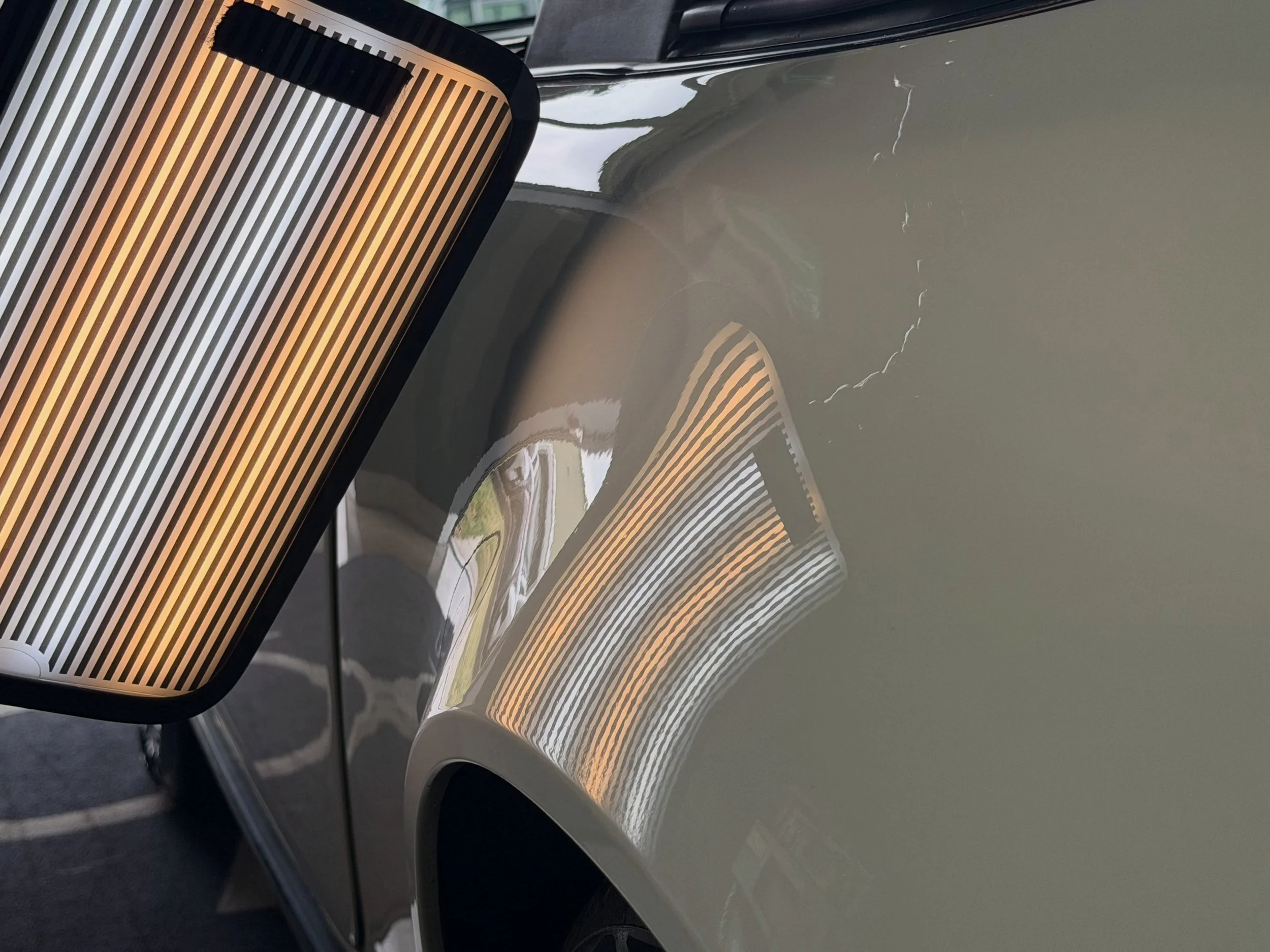 After: Classic 911 Super Carrera passengers side rear quarter dent free and ready to get back on the road!