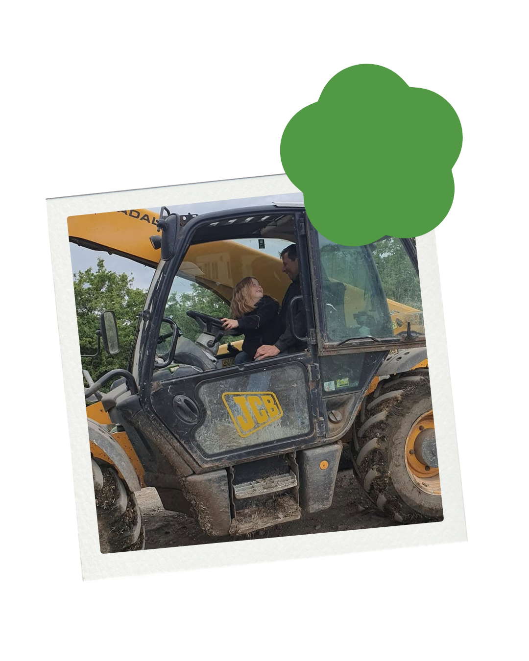 A man and a woman in a JCB construction vehicle, engaging in conversation, with trees and a cloudy sky in the background.
