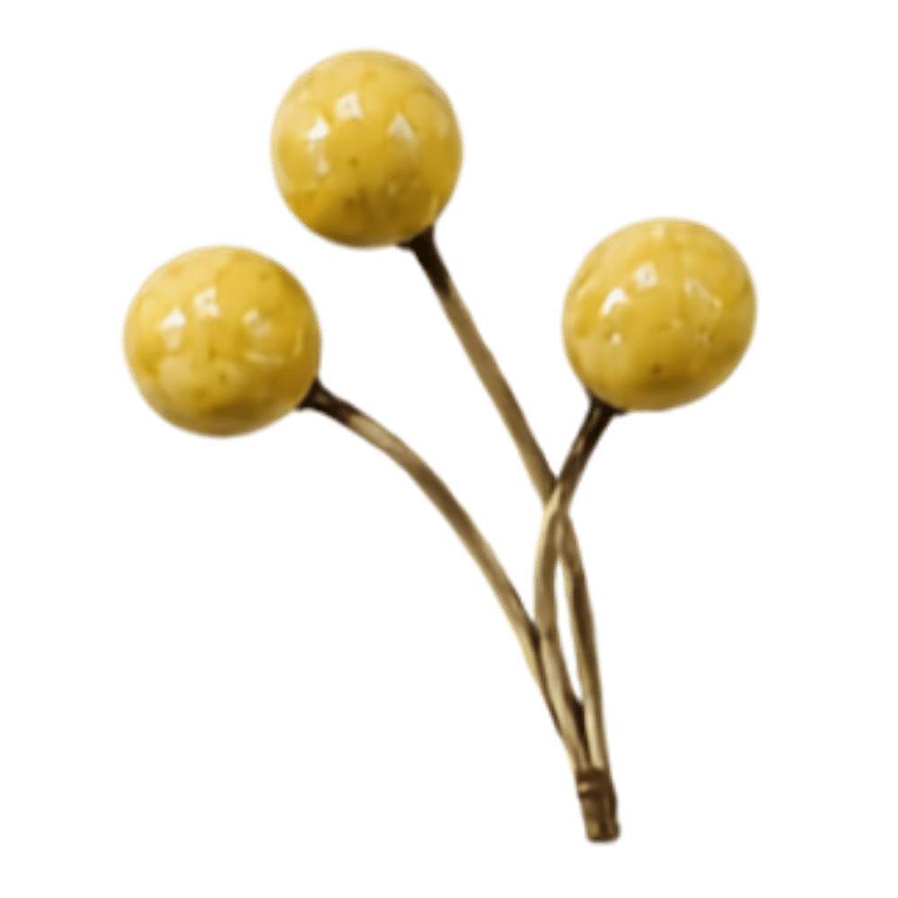 A decorative pin with three yellow spherical berries or balls on gold-colored stems.