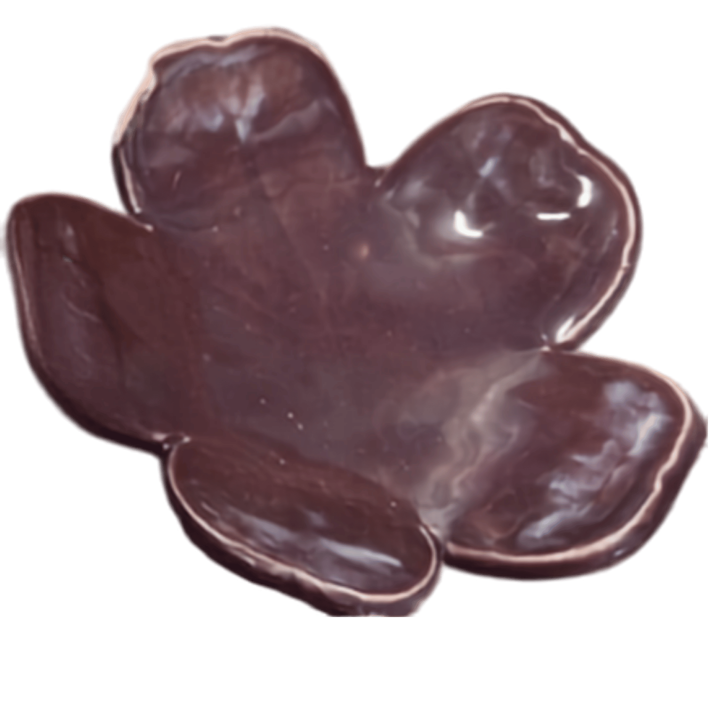 Close-up of a dark chocolate flower with petal details.