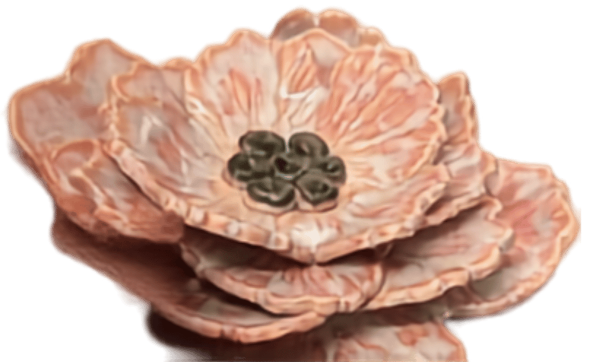 Close-up of a peach-colored flower with multiple layers of ruffled petals and a dark center.
