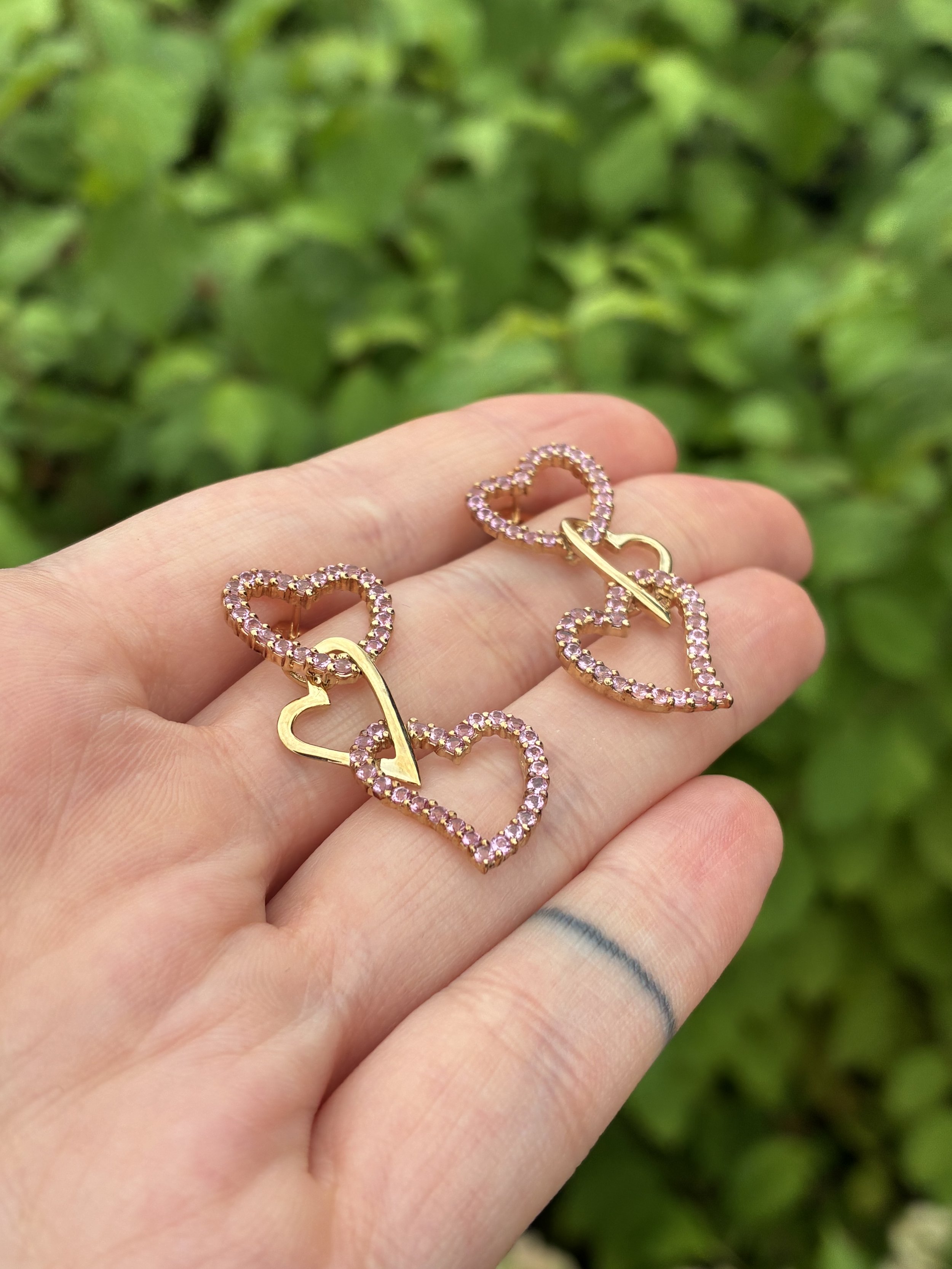 Heart Earrings held in hand