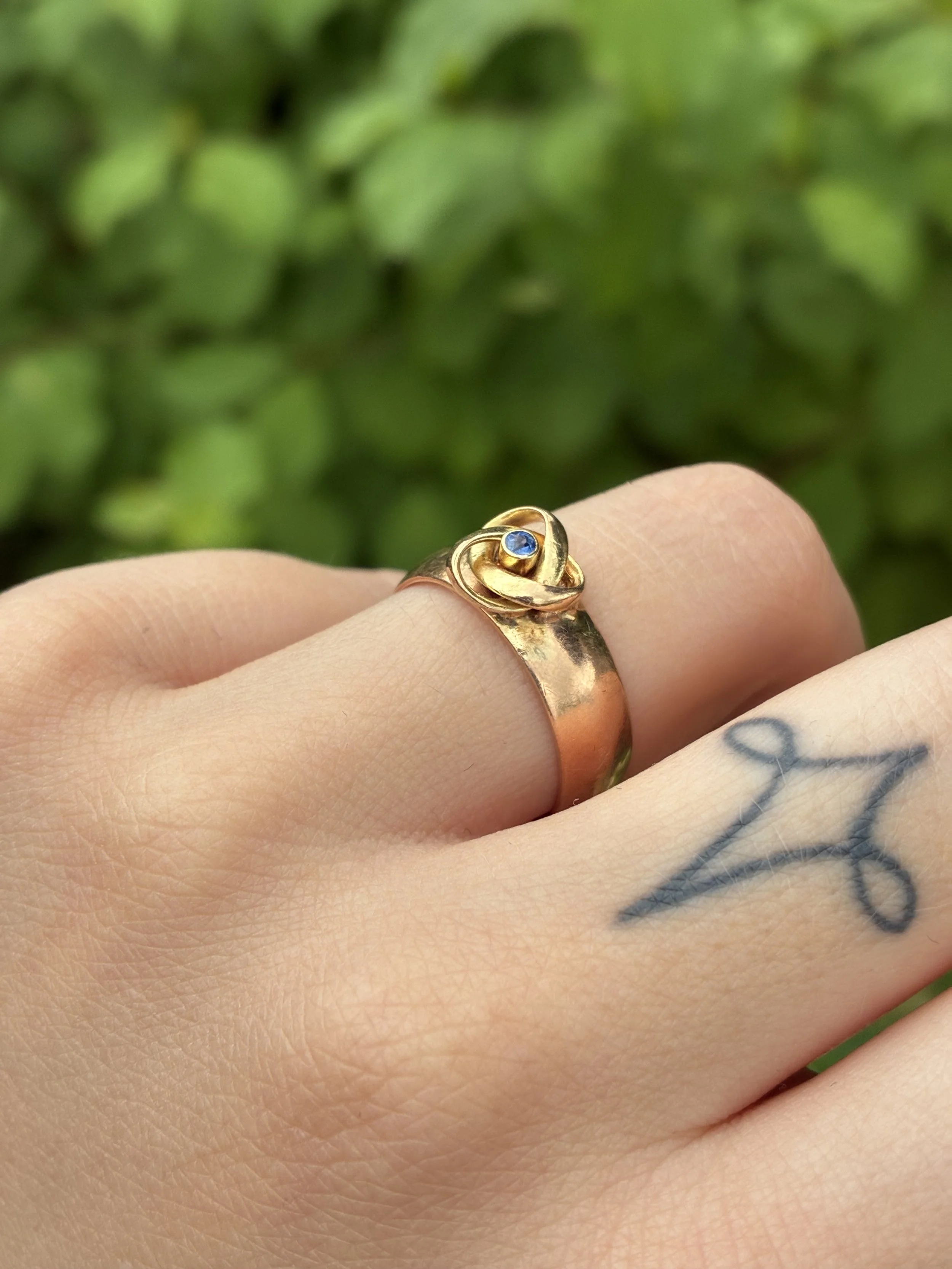 Sapphire Knot ring on hand