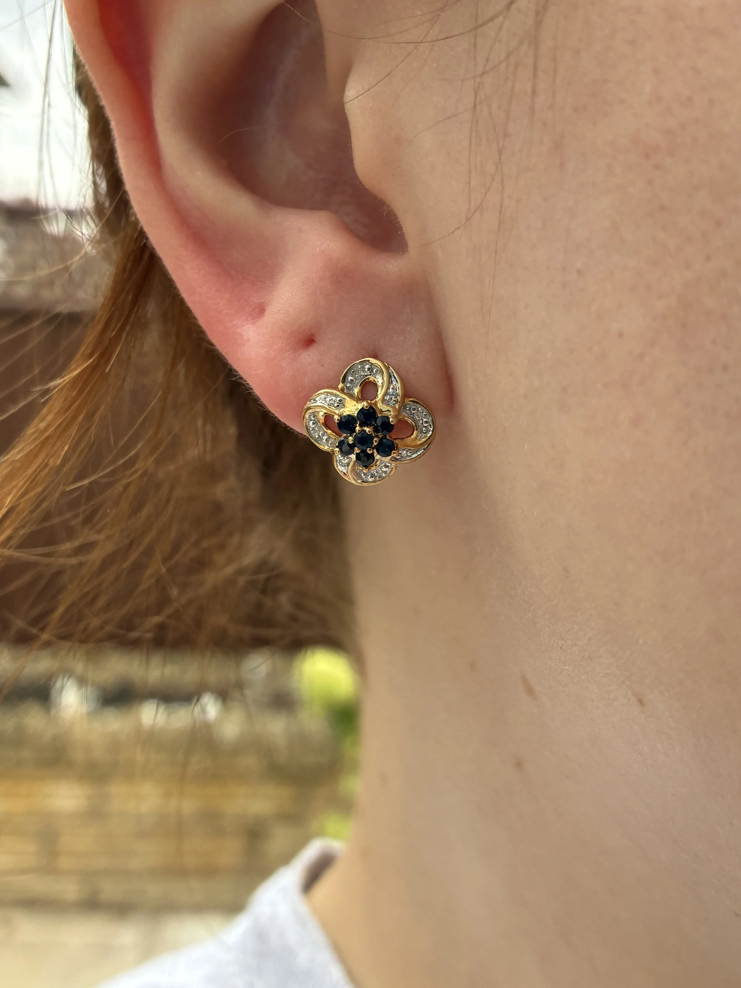 Flower Cluster Earrings in ear