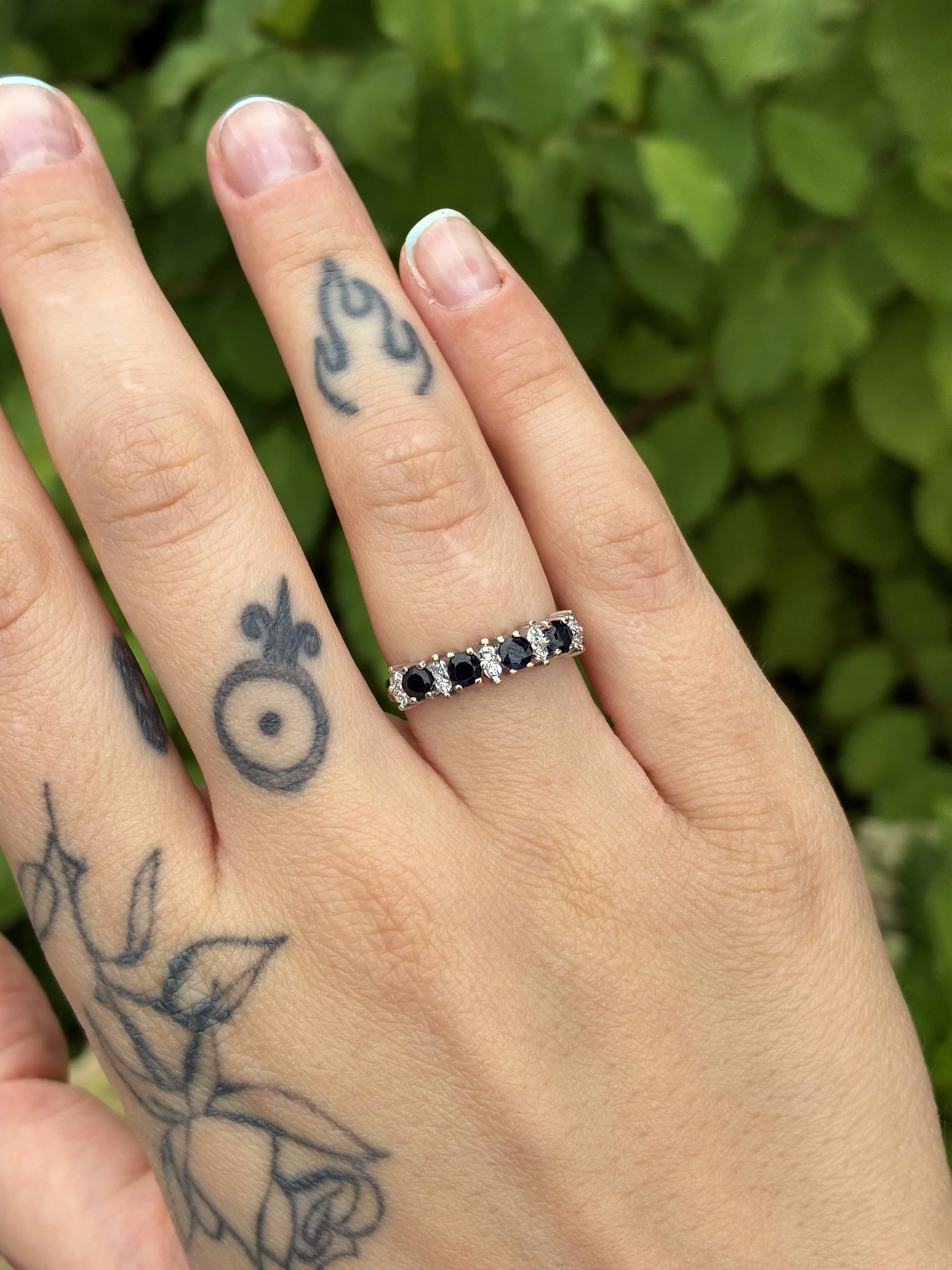 Sapphire and diamond ring on hand