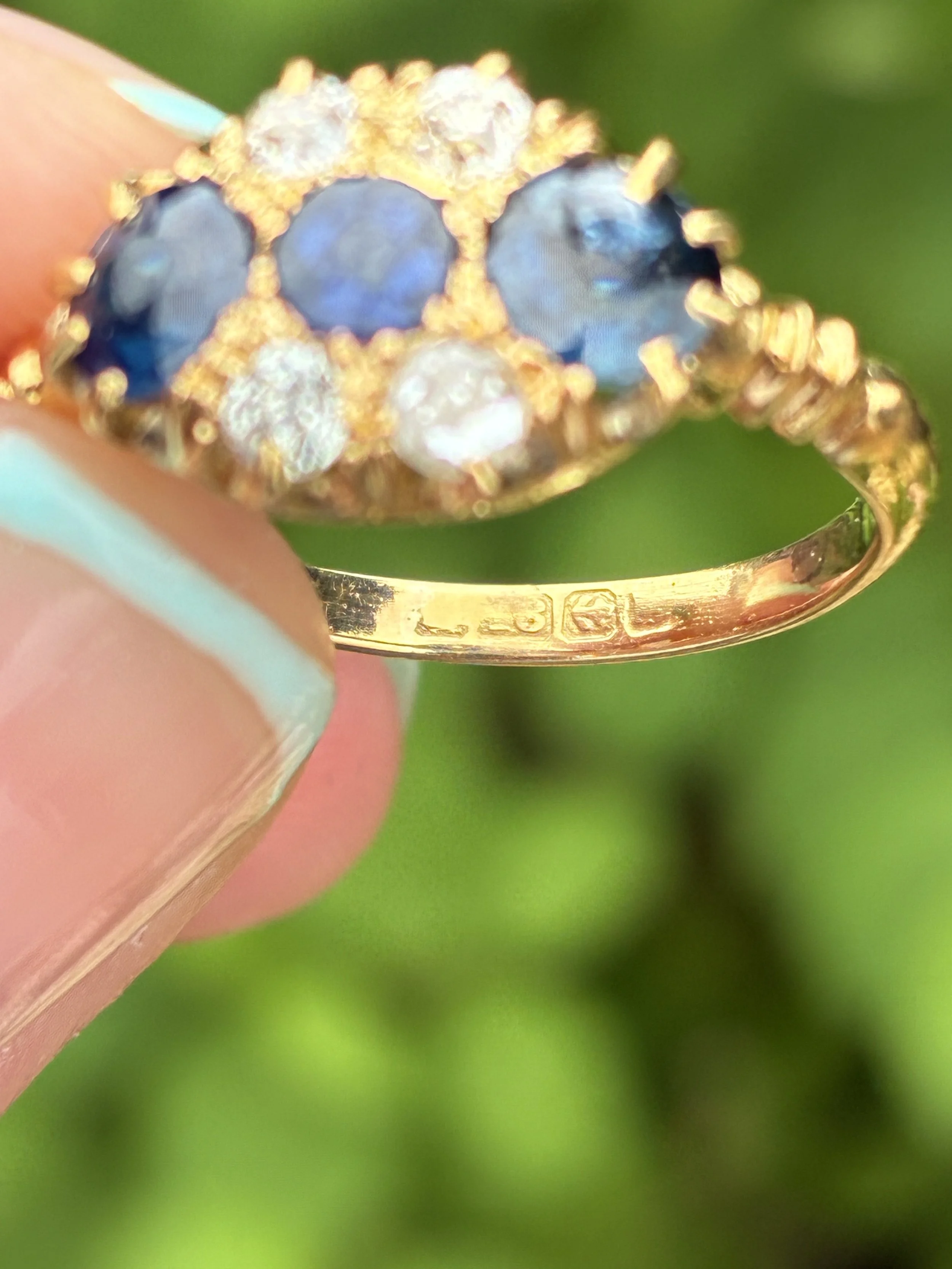 Beautiful Sapphire and Diamond cluster ring hallmark image