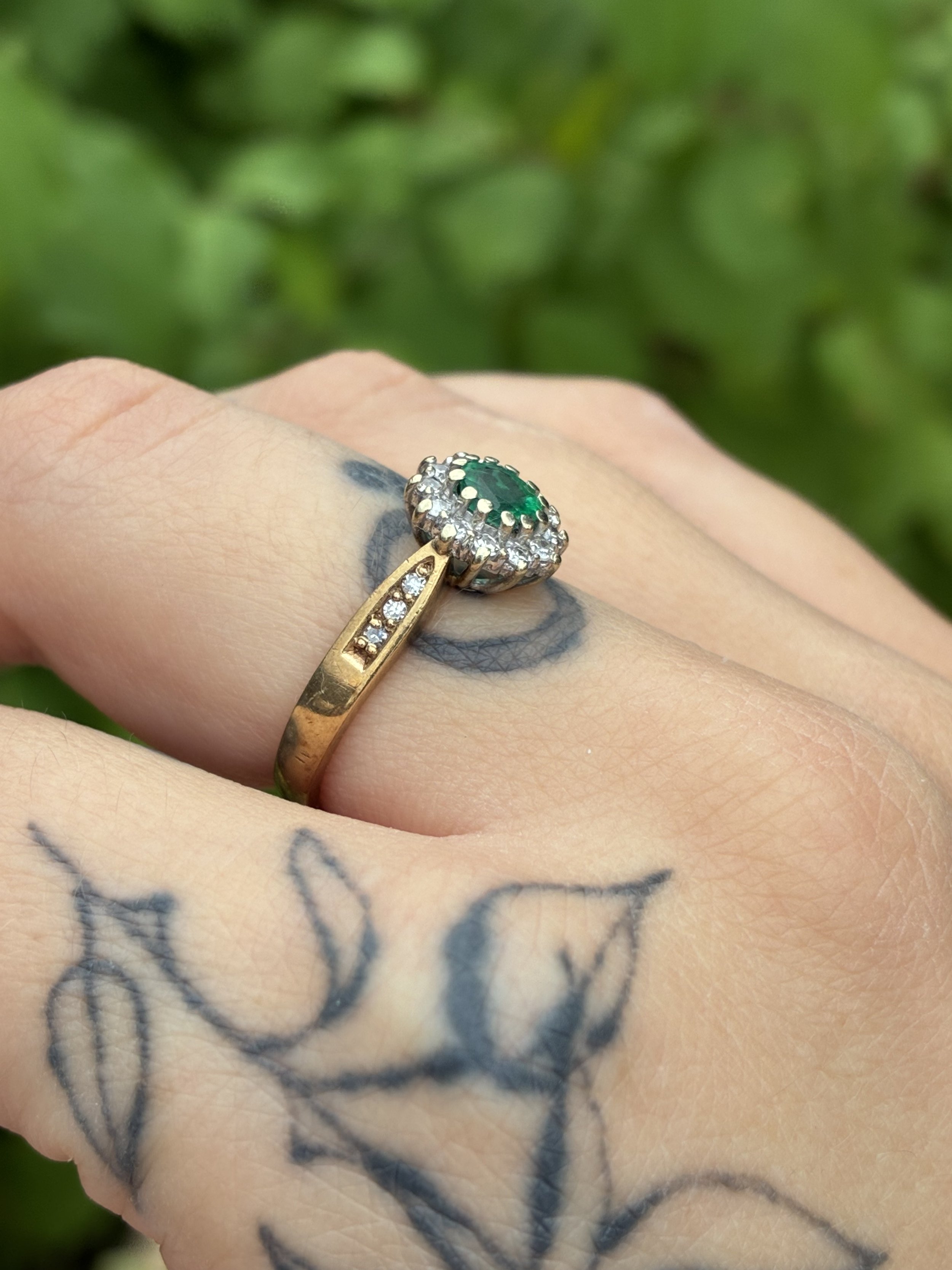 Emerald and Diamond Cluster side profile on hand