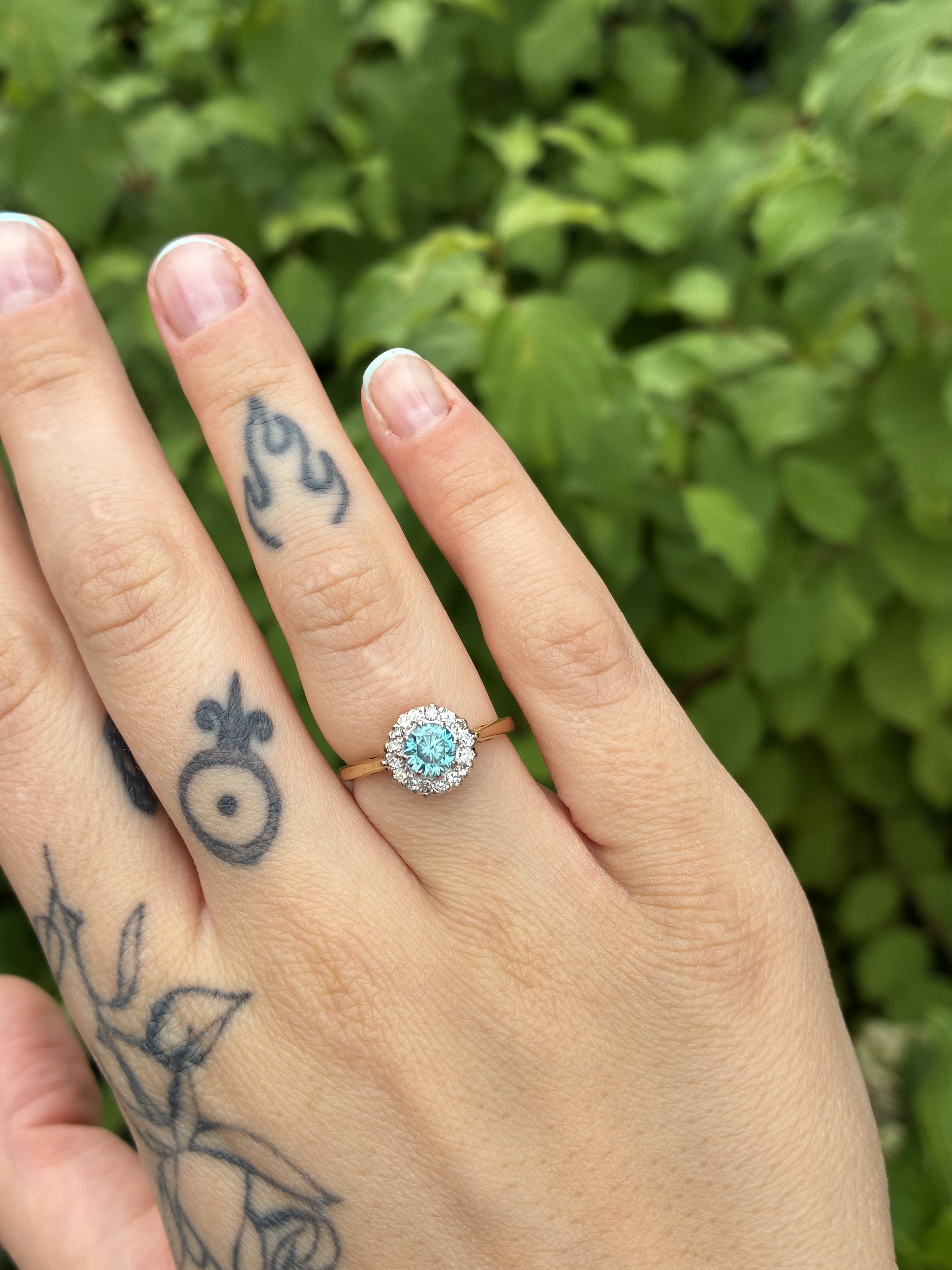 Blue Zircon cluster on hand