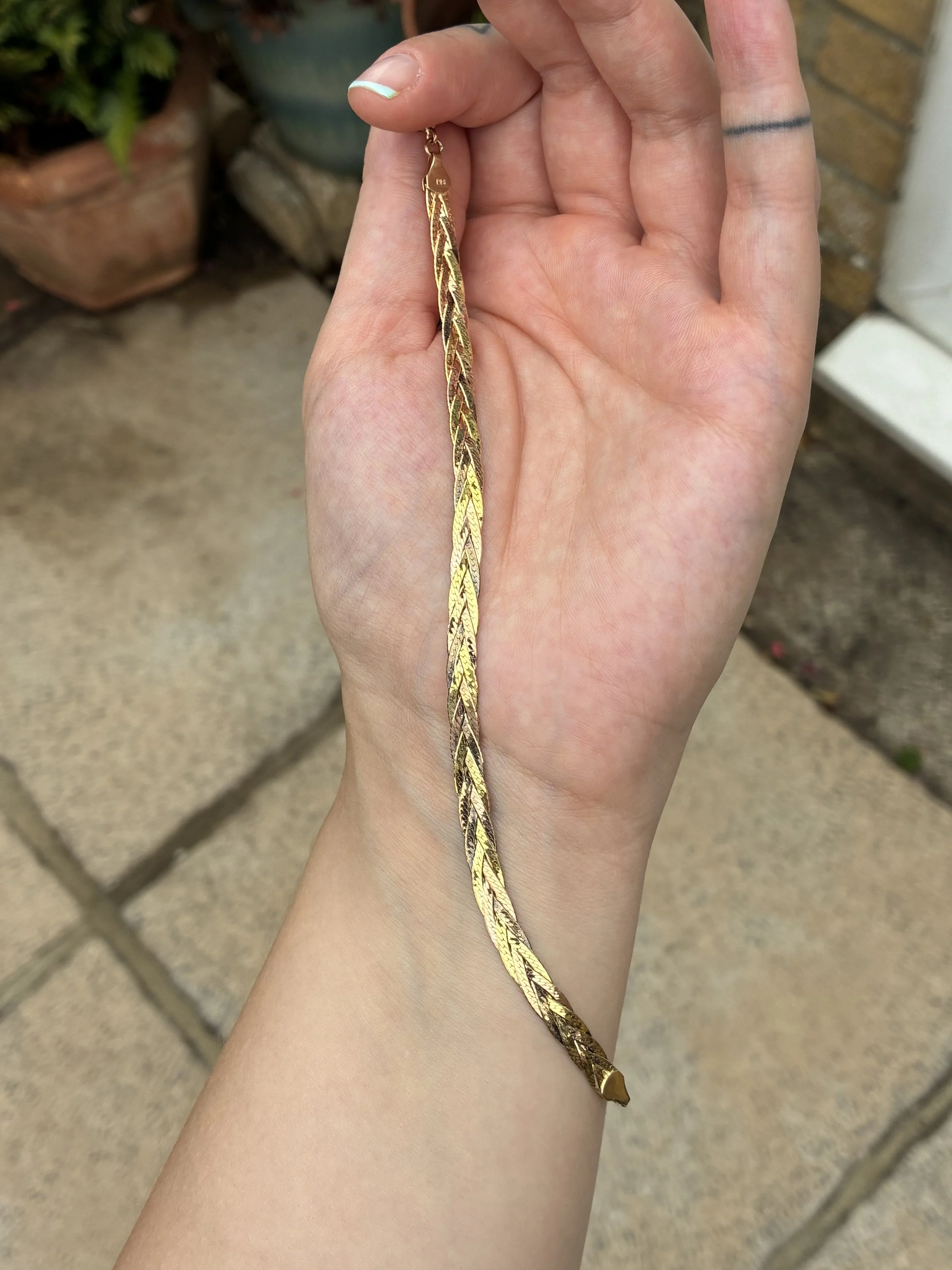 Plaited Bracelet held in hand