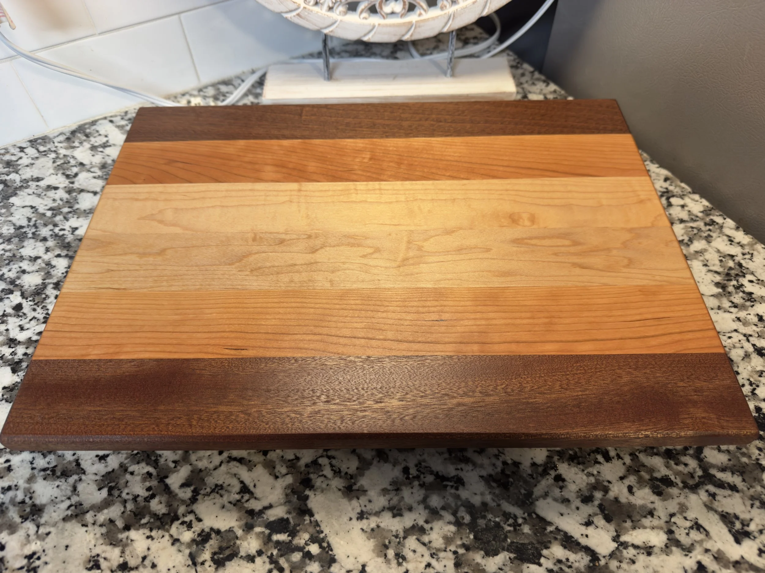 Second lightweight striped wooden cutting board without handles