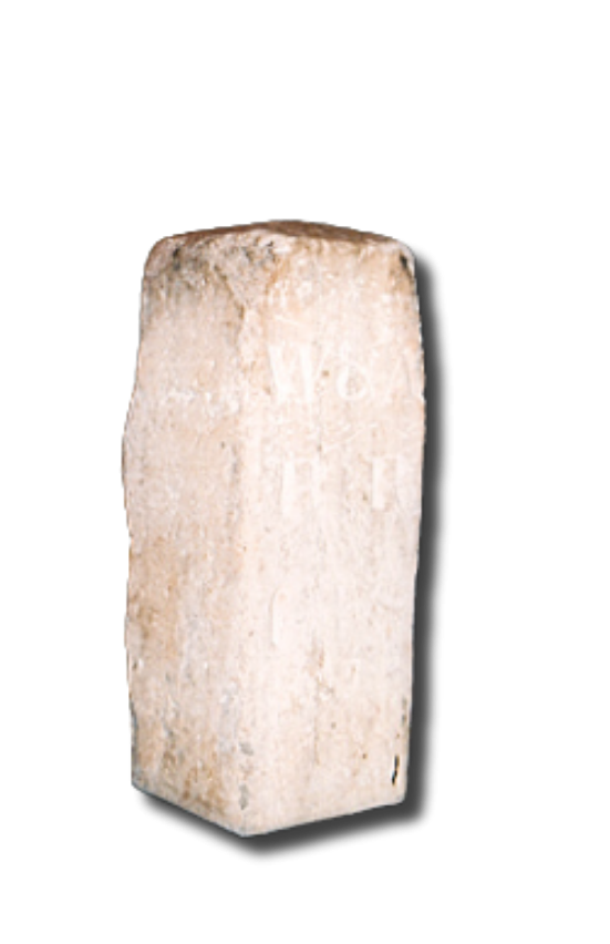 An ancient rectangular limestone pillar with engraved inscriptions, isolated against a black background.
