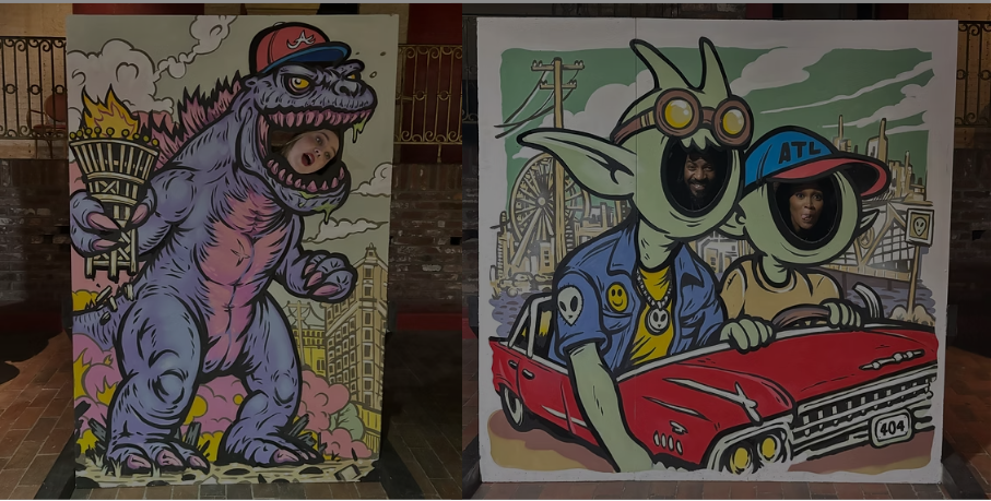 Two photo booth cutouts with faces in animated character designs. The left features a purple monster with a hat, holding a flaming torch. The right shows two characters with faces in a drawing of a red car at an amusement park, with one character wearing goggles and the other with a hat labeled 'ATL'.