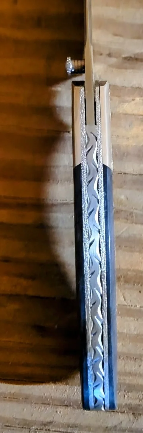 ba-dodson-camel-bone-mokume-folder-backspacer-filework-detail (2).jpg