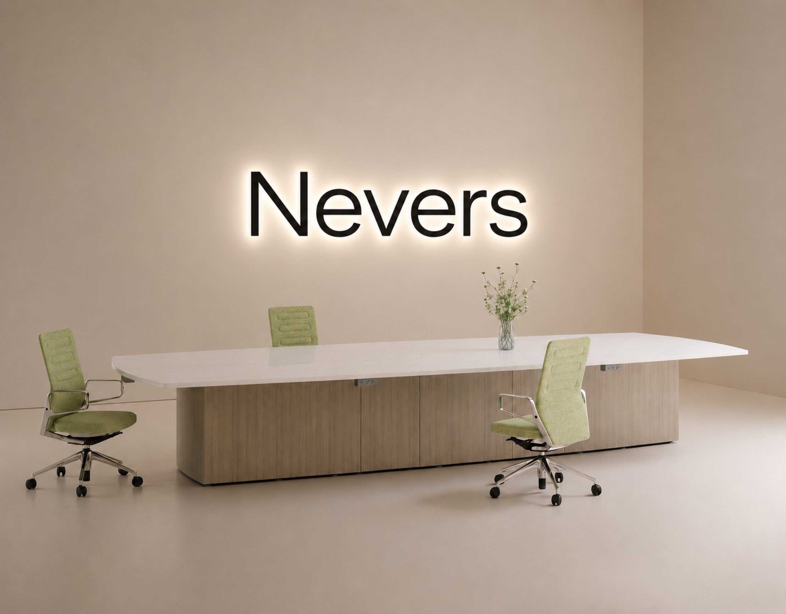 A modern conference room with a white oval table, neon-lit sign on the beige wall that says "Never" in black letters, and four green office chairs, one of which has a transparent base, two with wheels, and a vase with flowers on the table.