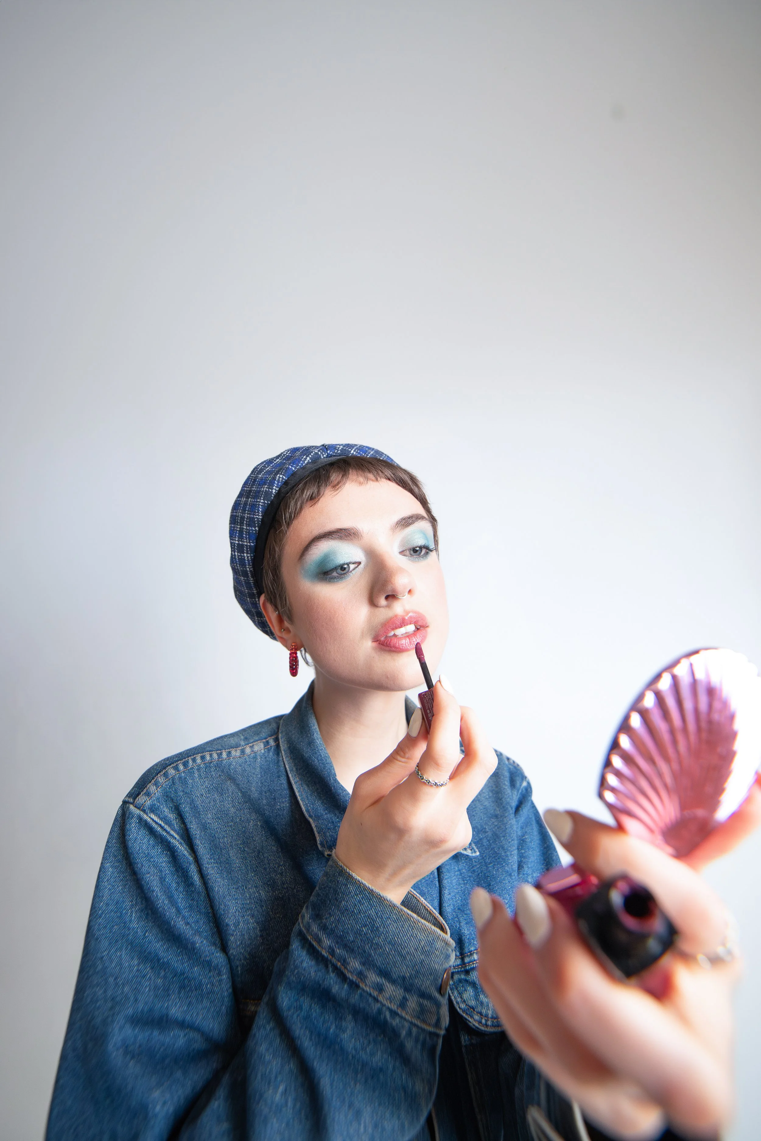 90s inspired editorial. Sculpted skin and modern styling with cool‑tone patterns. Makeup by Kinga for editorial, campaign, and creative direction.