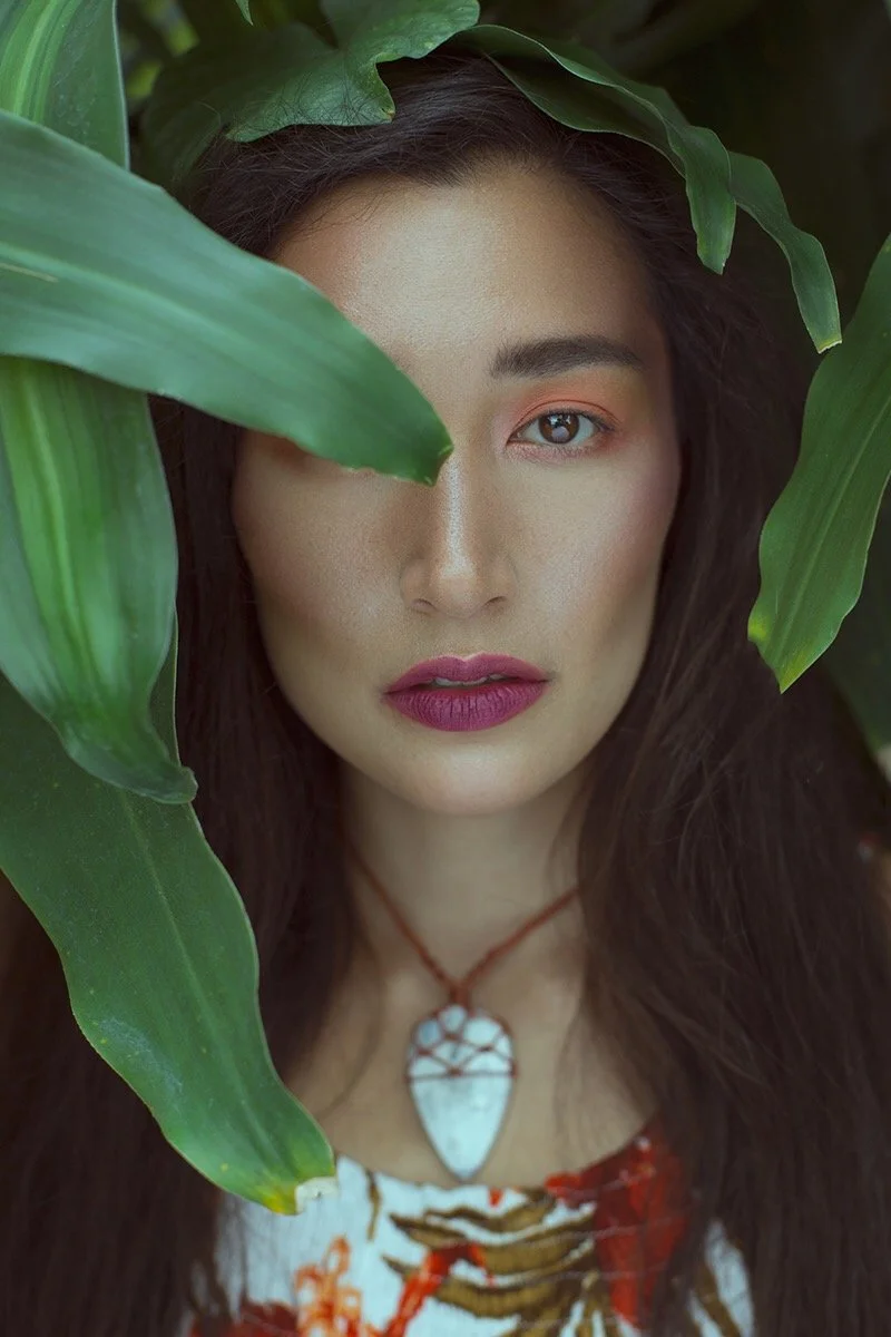 Fresh, glowing complexion with natural textures and botanical styling. Editorial beauty by Kinga, celebrating inclusive, refined artistry.