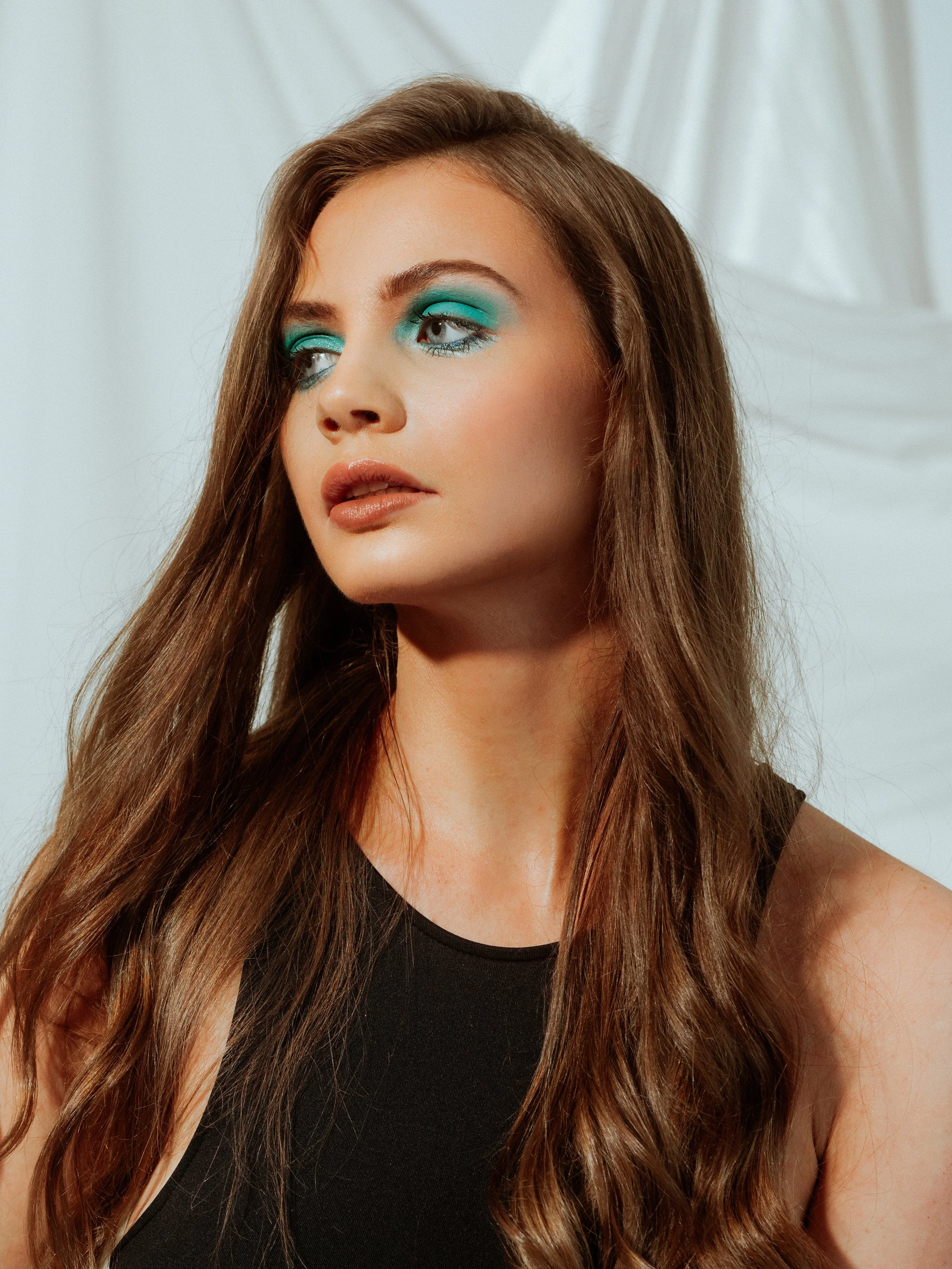 Modern use of colour in makeup. Blue eyeshadow with soft focus skin work. Editorial beauty by Kinga for commercial and beauty imagery