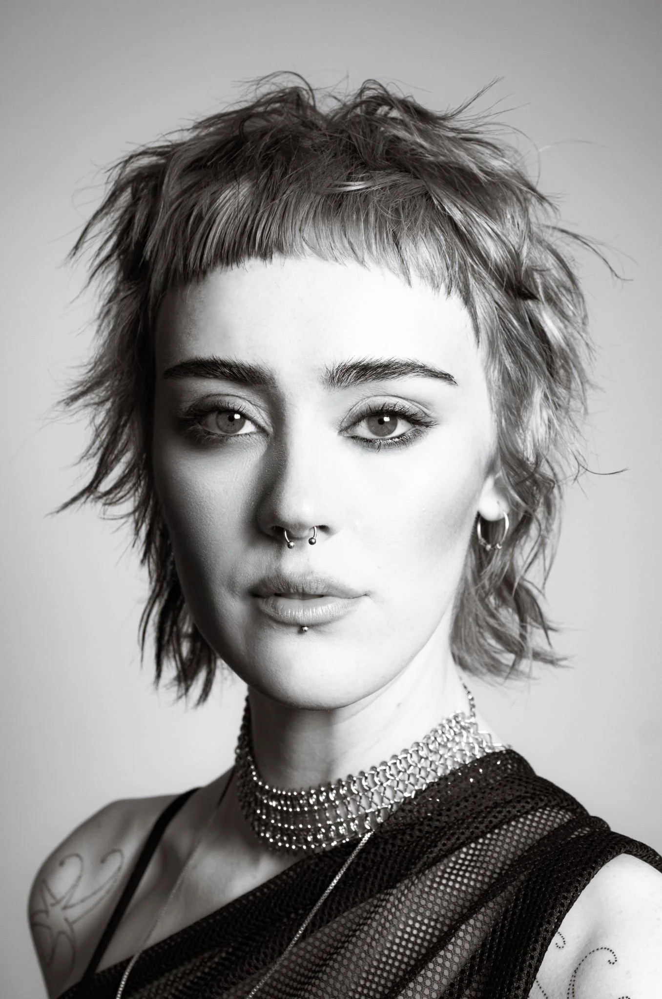 Short‑hair modern portrait. Clean, contemporary 90s inspired makeup with soft matte skin and defined eyes. Leeds‑based editorial artistry by Kinga.