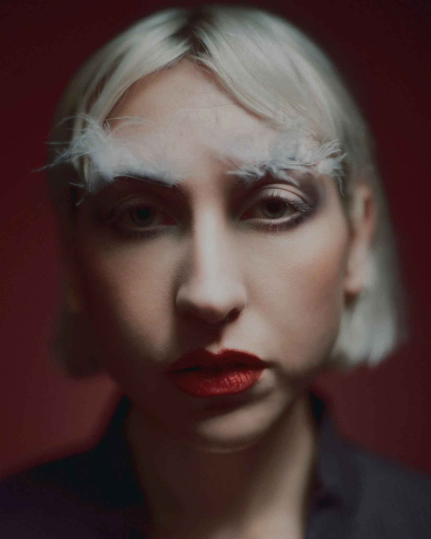 Feathery brow editorial, red toned lipstick and sculpted eyes and face. Editorial artistry by Kinga for fashion and creative media
