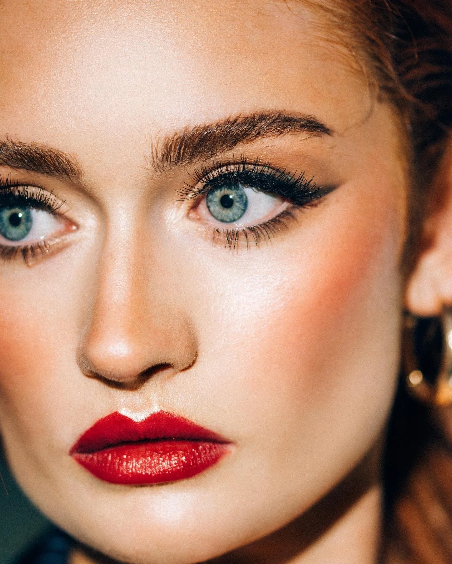 Precision, bold eyeliner worm with sculpted features and refined skin work. Editorial beauty by Kinga for commercial and beauty imagery