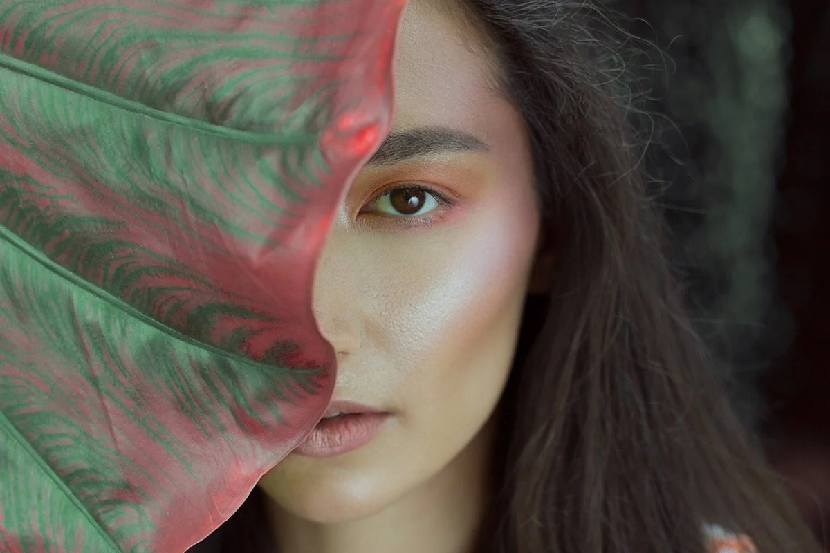 Fresh, glowing complexion with natural textures and botanical styling. Editorial beauty by Kinga, celebrating inclusive, refined artistry.