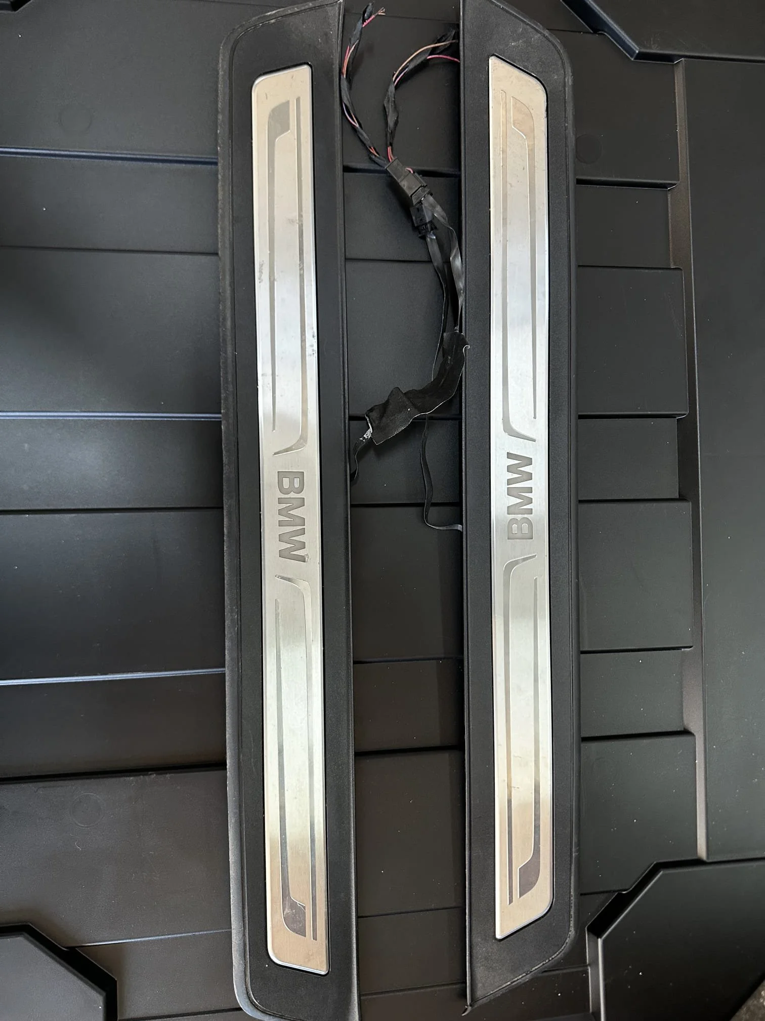 Original BMW illuminated door sill trims