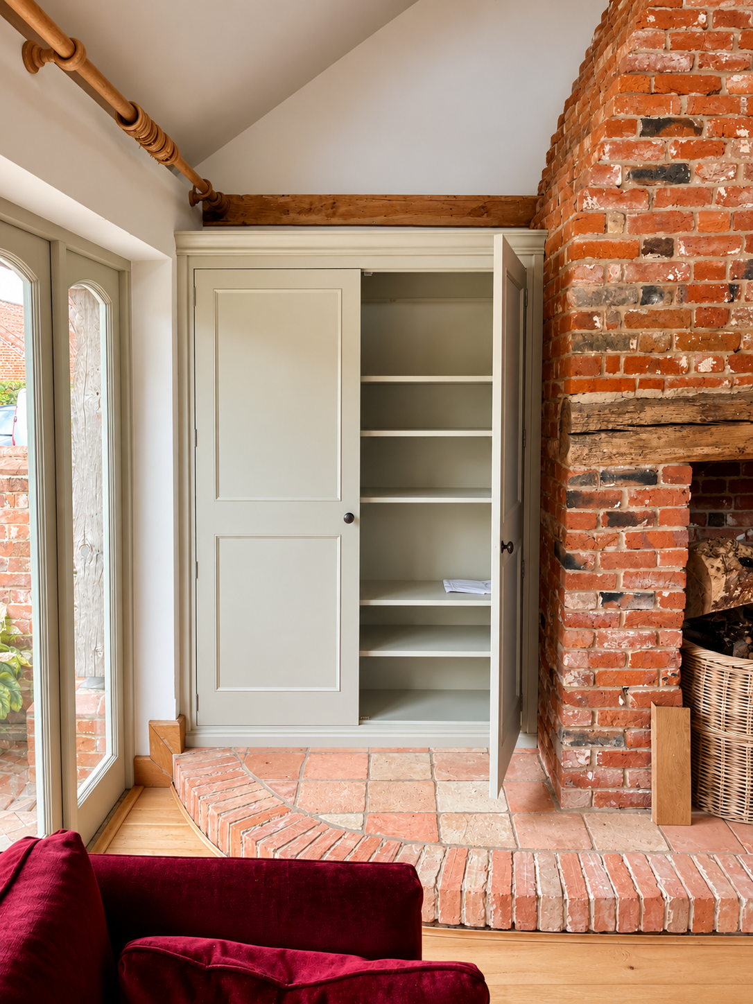 Rustic Sage Cupboard by Brick Fireplace.png