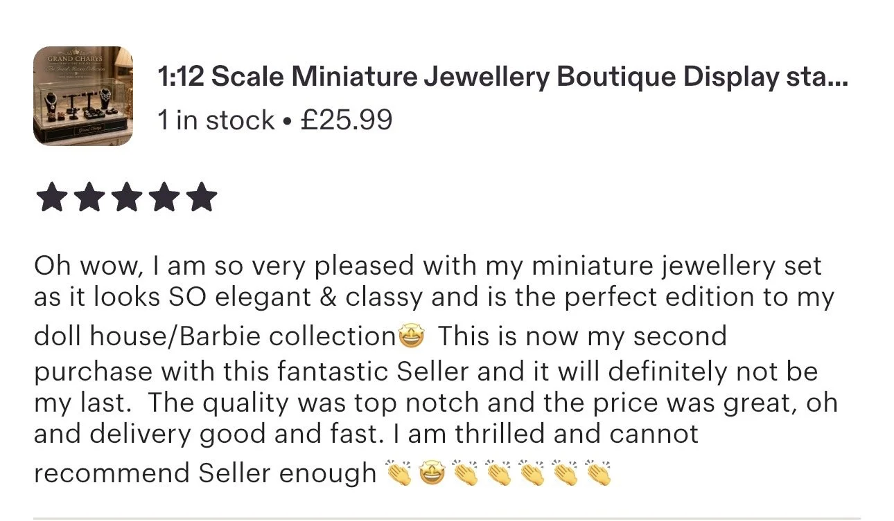 Miniature jewelry display stand with doll jewelry pieces. with a five star rating and positive customer review