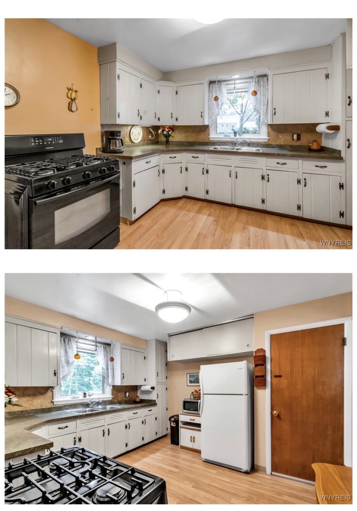Kitchen with white cabinets, a gas stove, a refrigerator, and a window with lace curtains. The kitchen has wood flooring and beige walls.