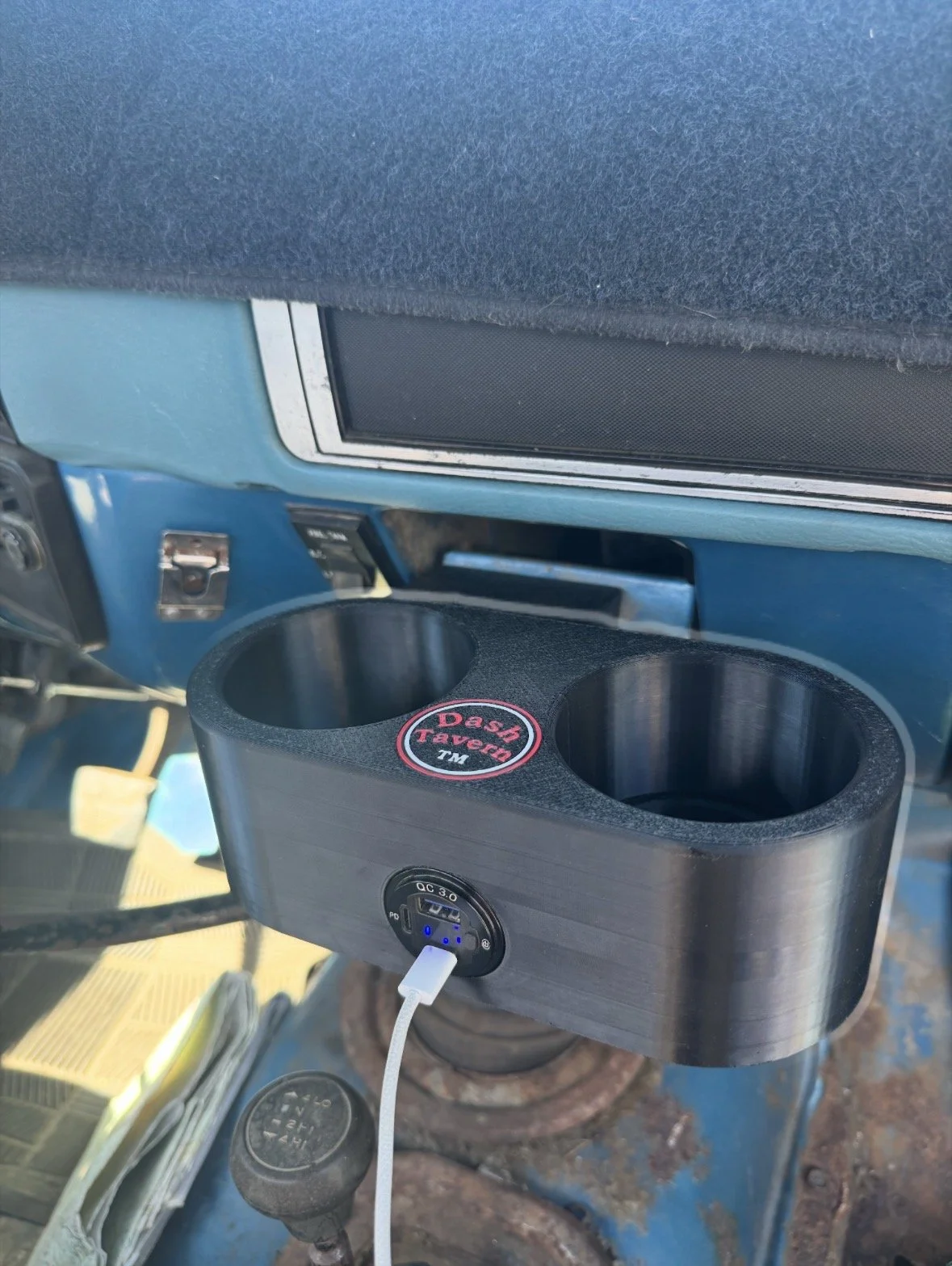 Dash Tavern dual cup holder installed in a Chevy GMC Squarebody dash with built-in USB-C fast charging