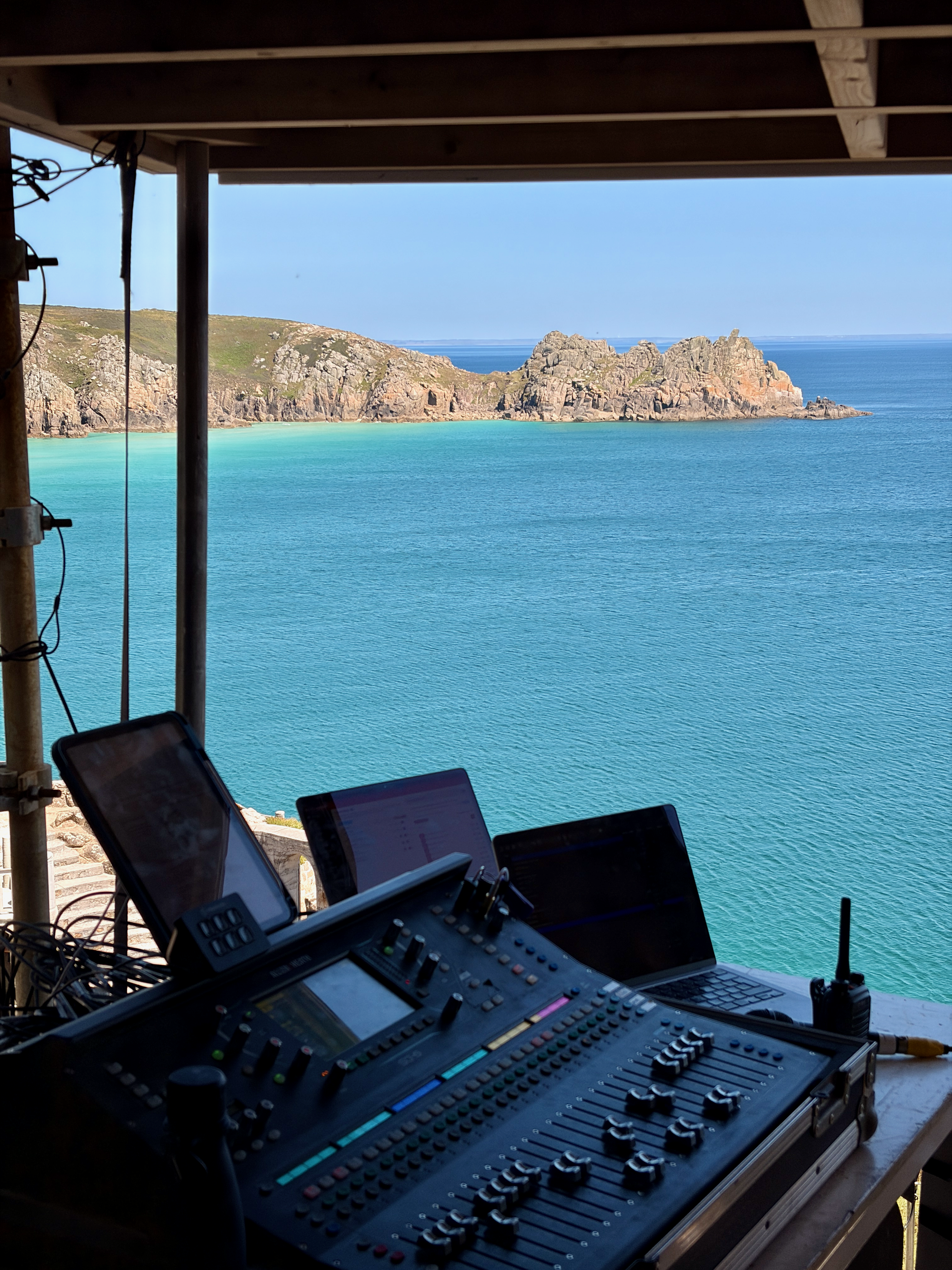 Allen & Heath SQ sound desk at the Minack Theatre overlooking the Cornish coastline and turquoise sea during a live theatre production.