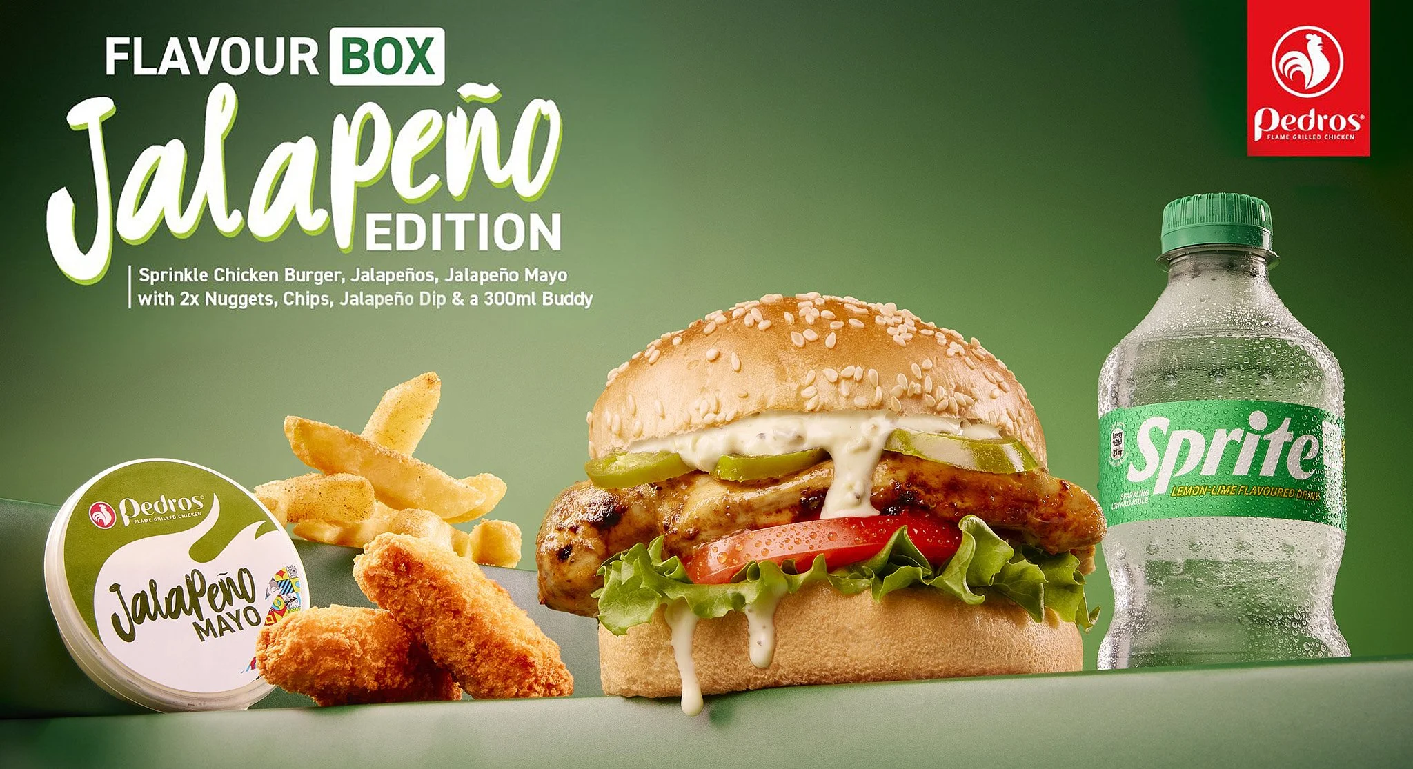 a chicken burger meal with fries, jalapeño mayo, and a Sprite lemon-lime soda on a green background.