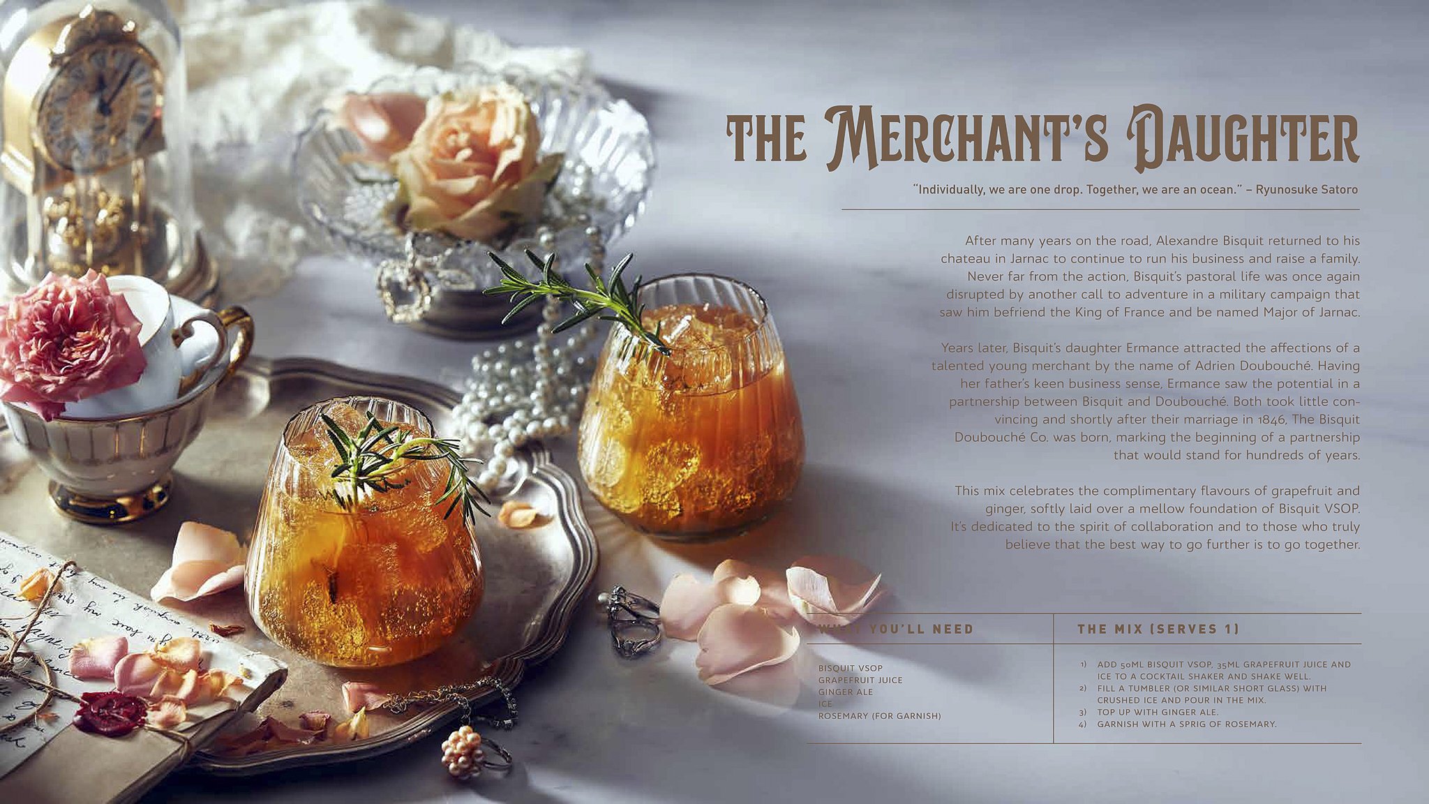 Two glass jars filled with an orange-colored beverage garnished with rosemary sprigs, placed on a silver tray among pink rose petals, with elegant tea cups, a mirror, and a decorative scene including a peach-colored rose and pearls.