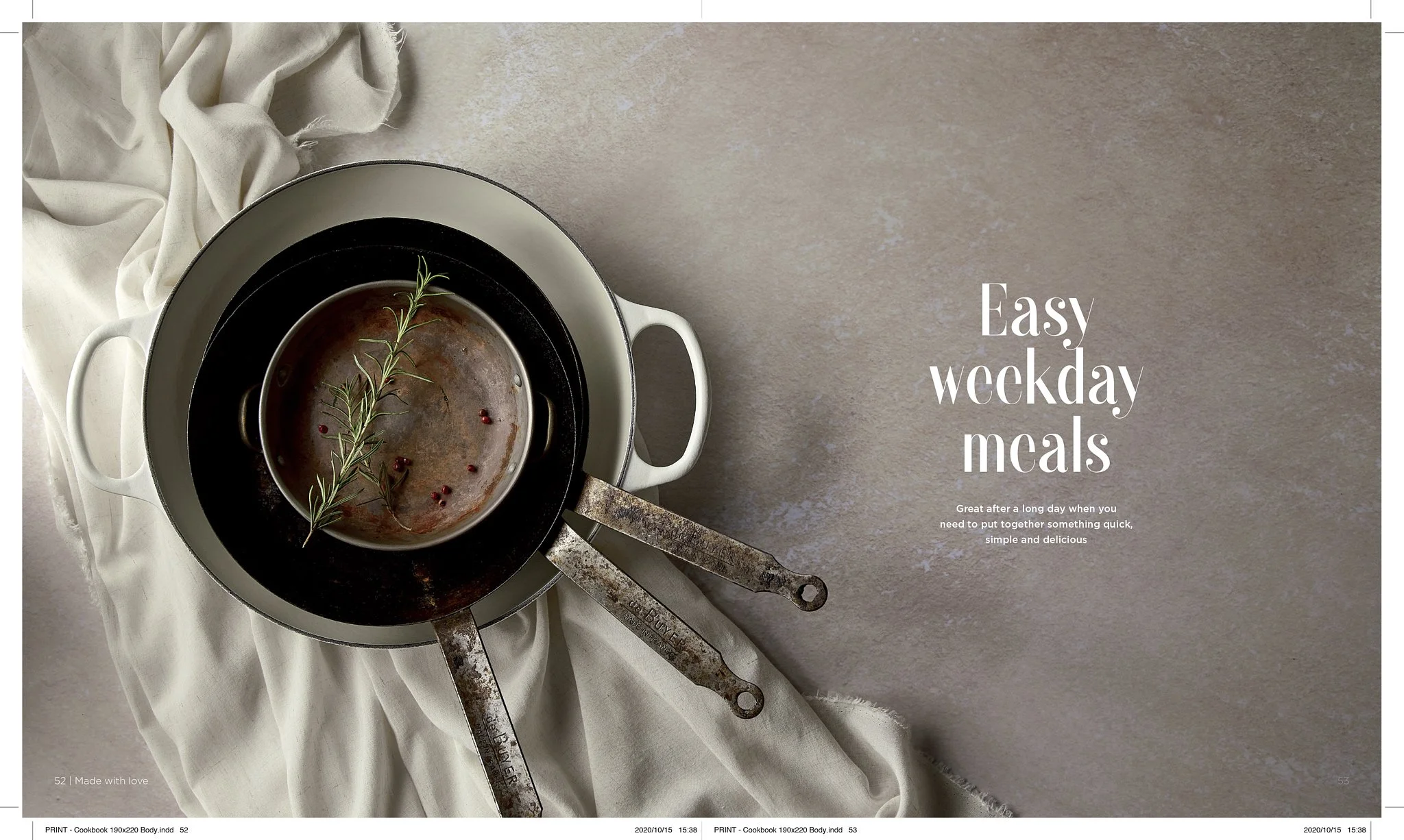 A stacked set of cooking pots with a sprig of rosemary and pink peppercorns inside, on a neutral textured surface, with white fabric draped nearby, and text reading 'Easy weekday meals'.