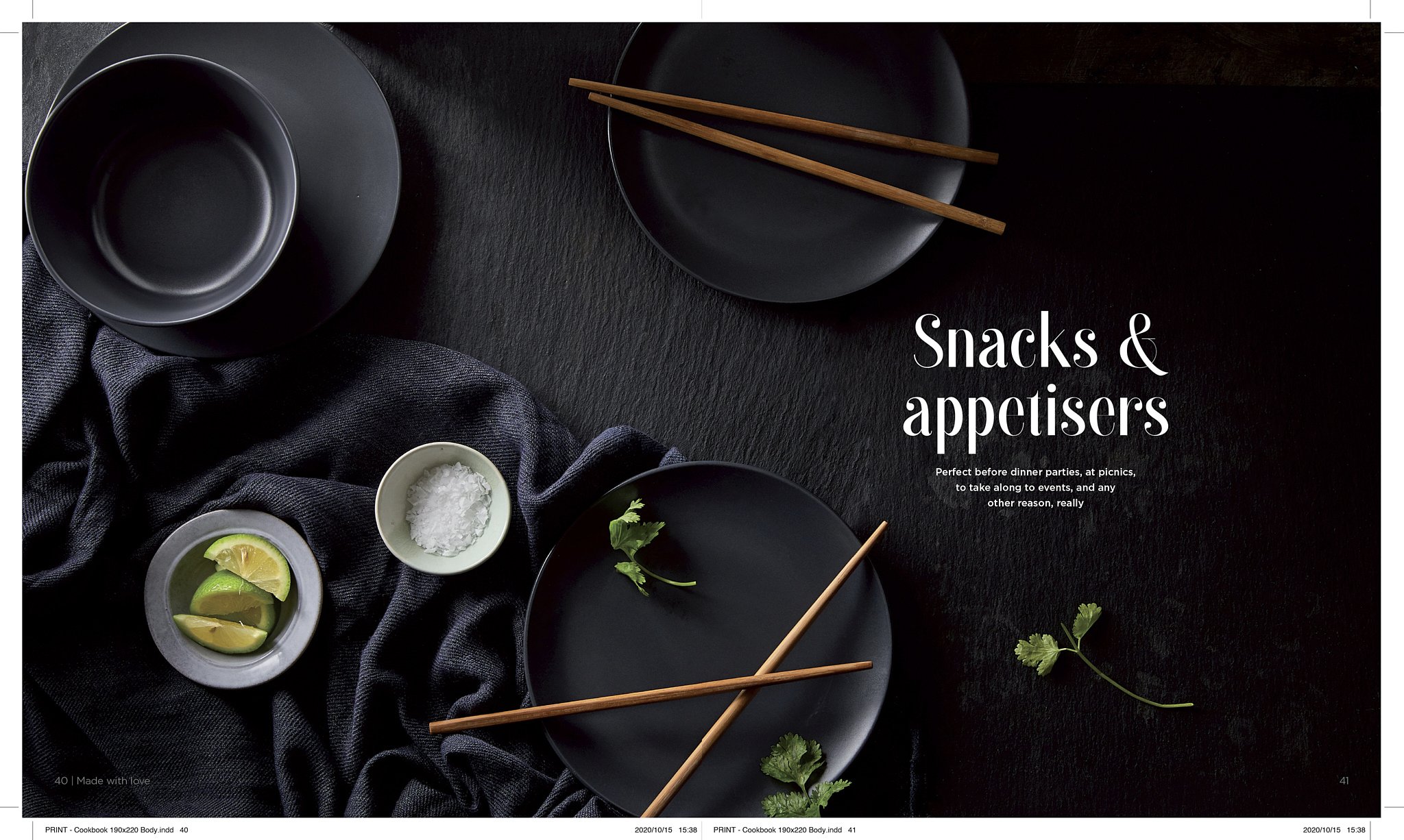 Black plates, chopsticks, lime wedges, salt, and fresh herbs on a dark textured surface, with the text 'Snacks & appetizers' visible.