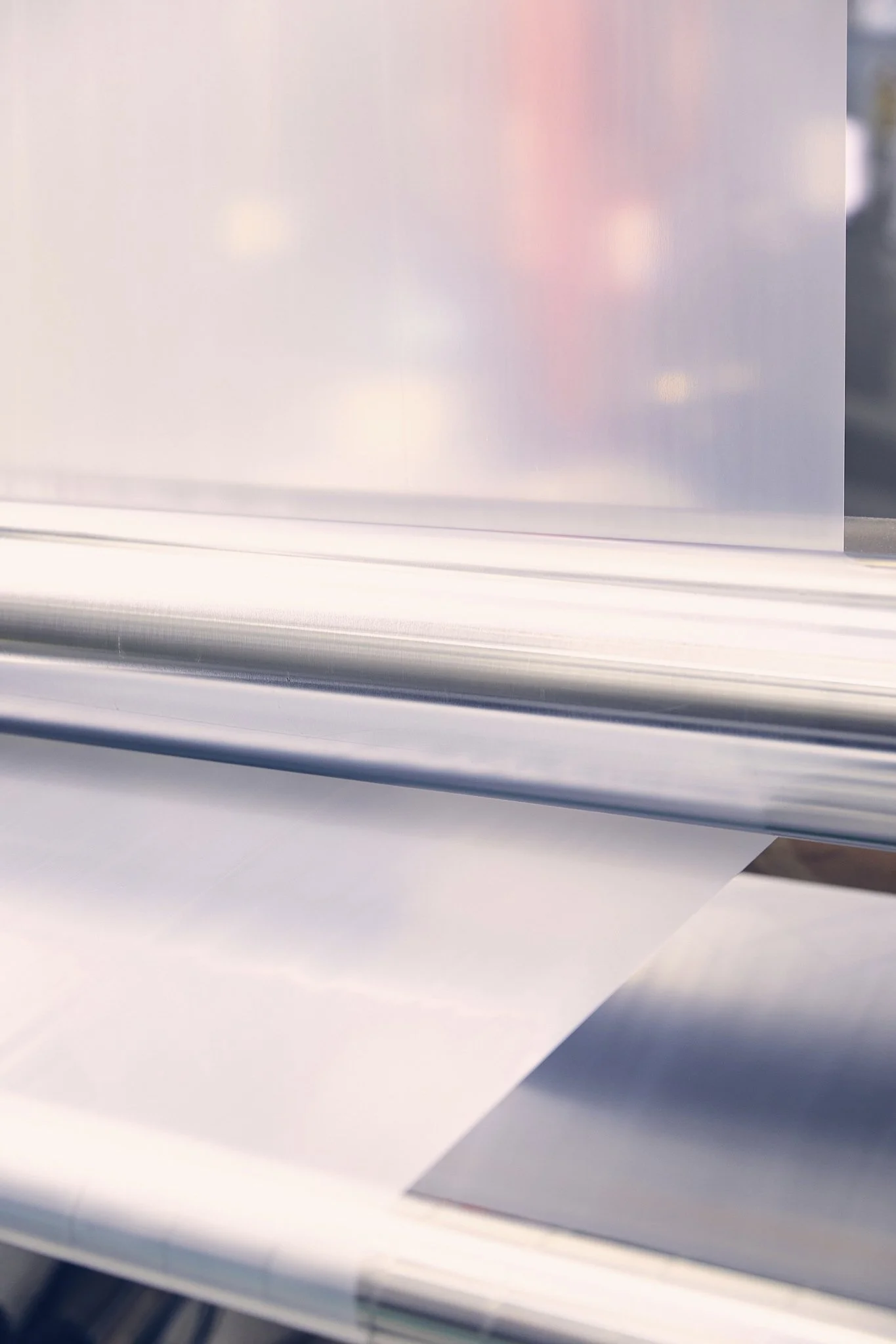 Close-up of an extrusion machine with plastic being processed.