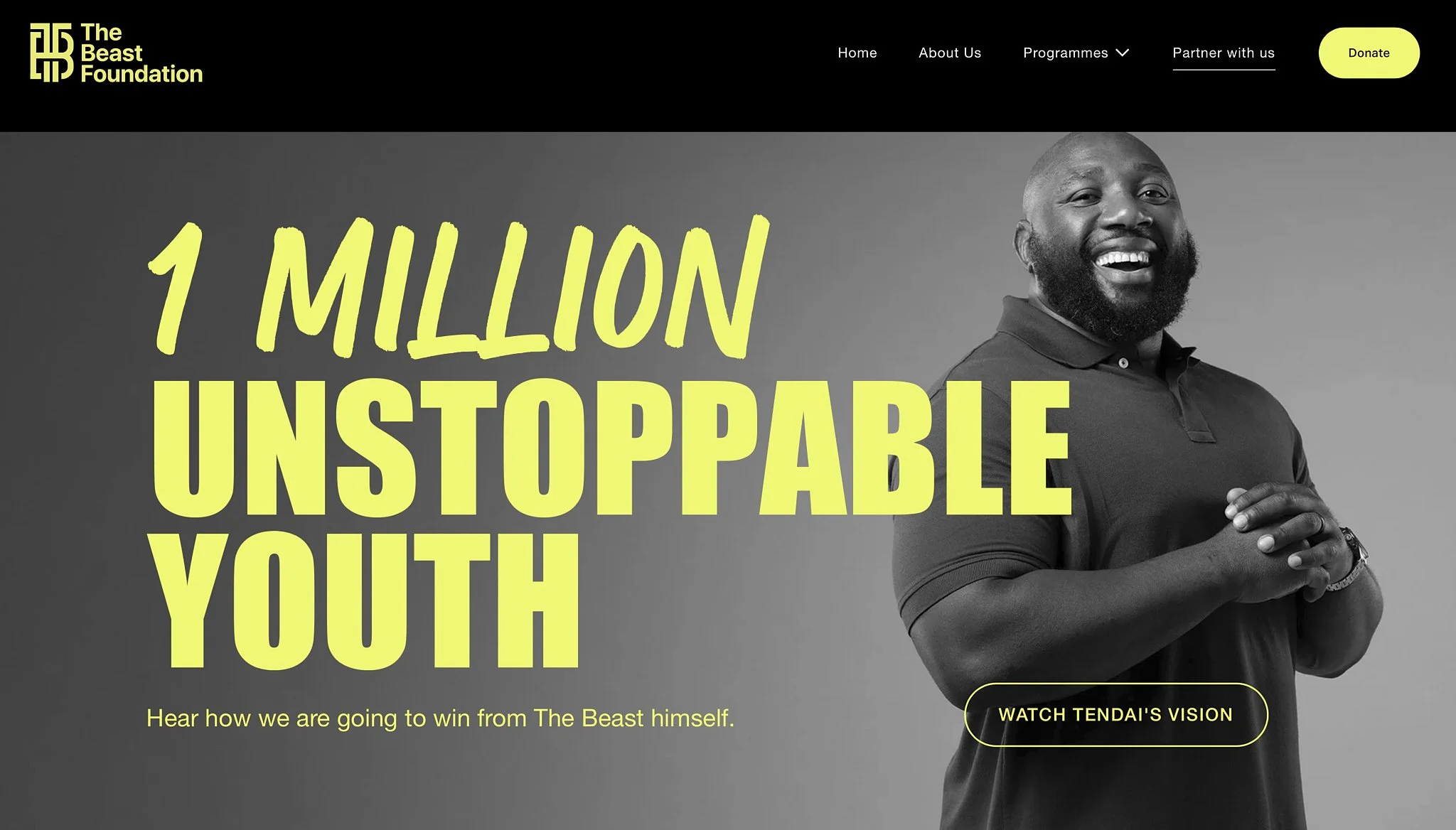 The homepage of The Beast Foundation website featuring a smiling man with a beard and short hair, wearing a dark polo shirt, with bold yellow text stating '1 MILLION UNSTOPPABLE YOUTH' and a call-to-action button labeled 'WATCH TENDAI'S VISION'.