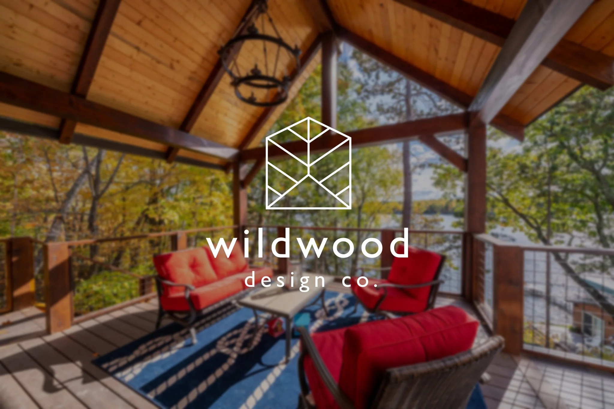 Wildwood Design Co Logo; porch overlooking lake