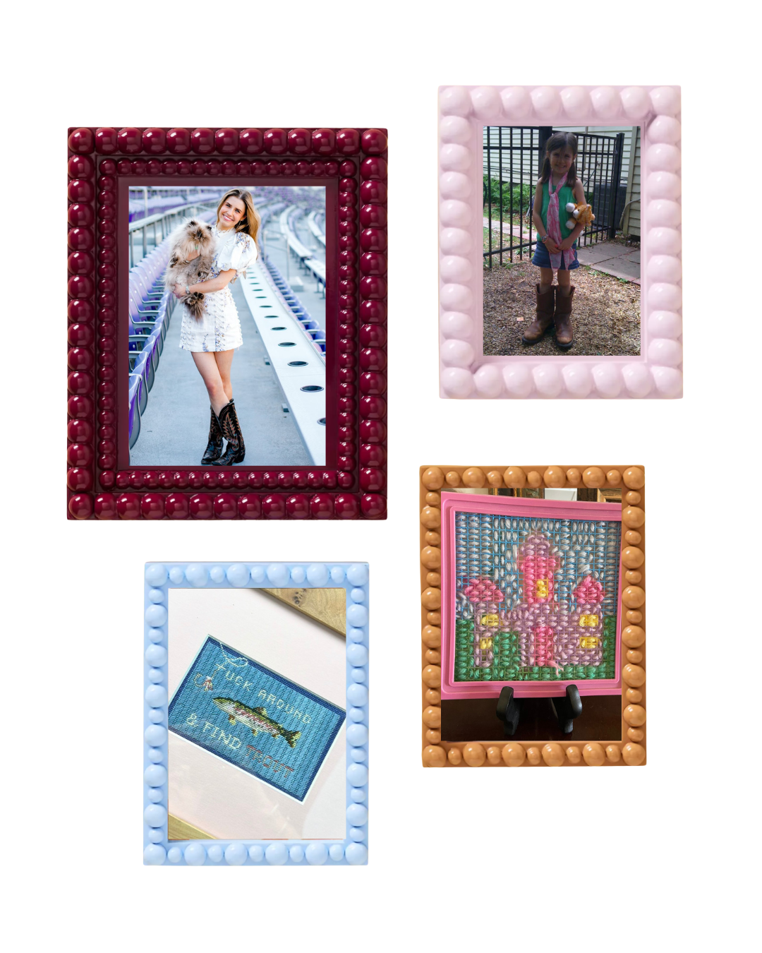 Collection of five picture frames with various photographs. The largest shows a smiling woman holding a fluffy dog at a track. A pink frame shows a young girl with pigtails standing outdoors with a teddy bear. A blue frame displays a cross-stitch of a fish and text. An orange frame contains an embroidered pink castle with flowers.