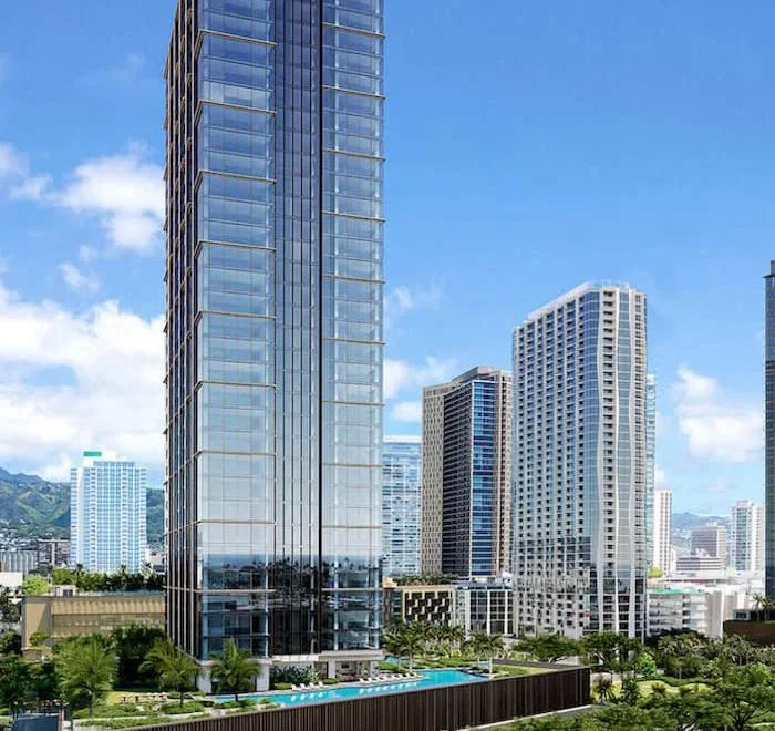 City skyline with tall glass skyscrapers, blue sky with clouds, and a swimming pool in the foreground.