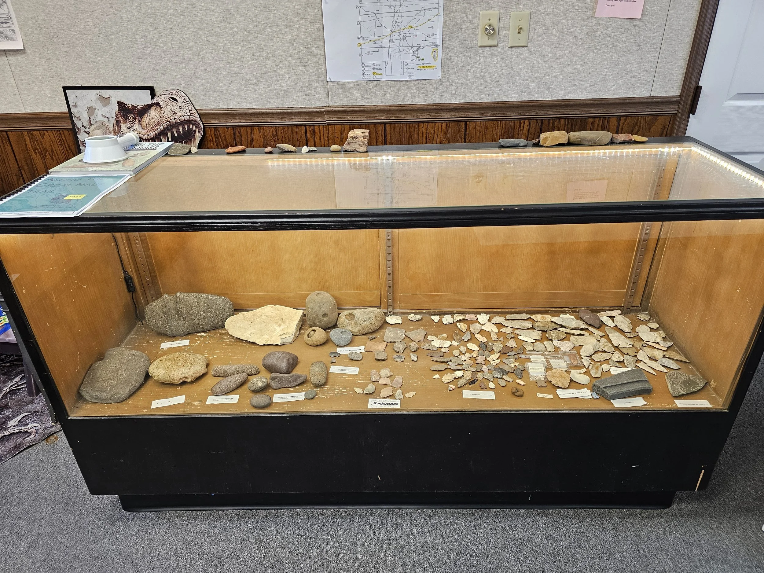 Display case featuring regional Indigenous artifacts and interpretive materials.